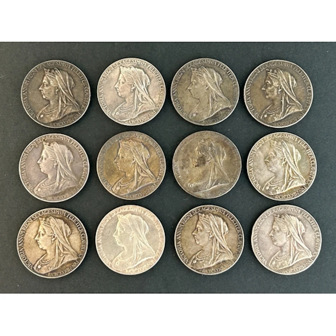 A collection of twelve official Royal Mint Victoria Diamond ...
