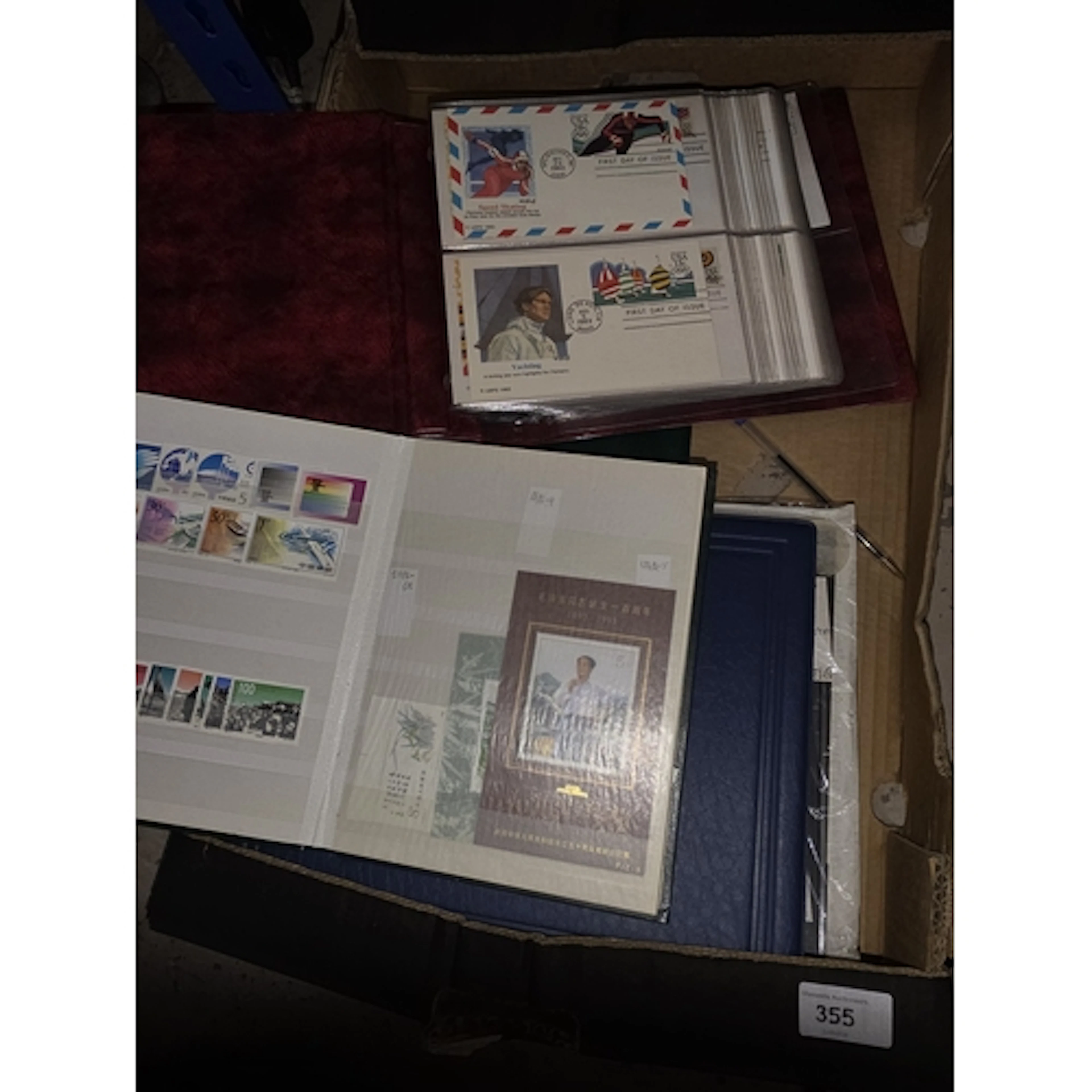 An album of world stamps and a stock book of Chinese stamps;...