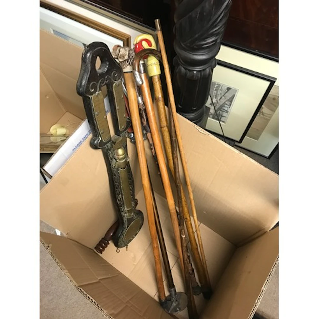 A collection of walking sticks and a retrospective copy of a...