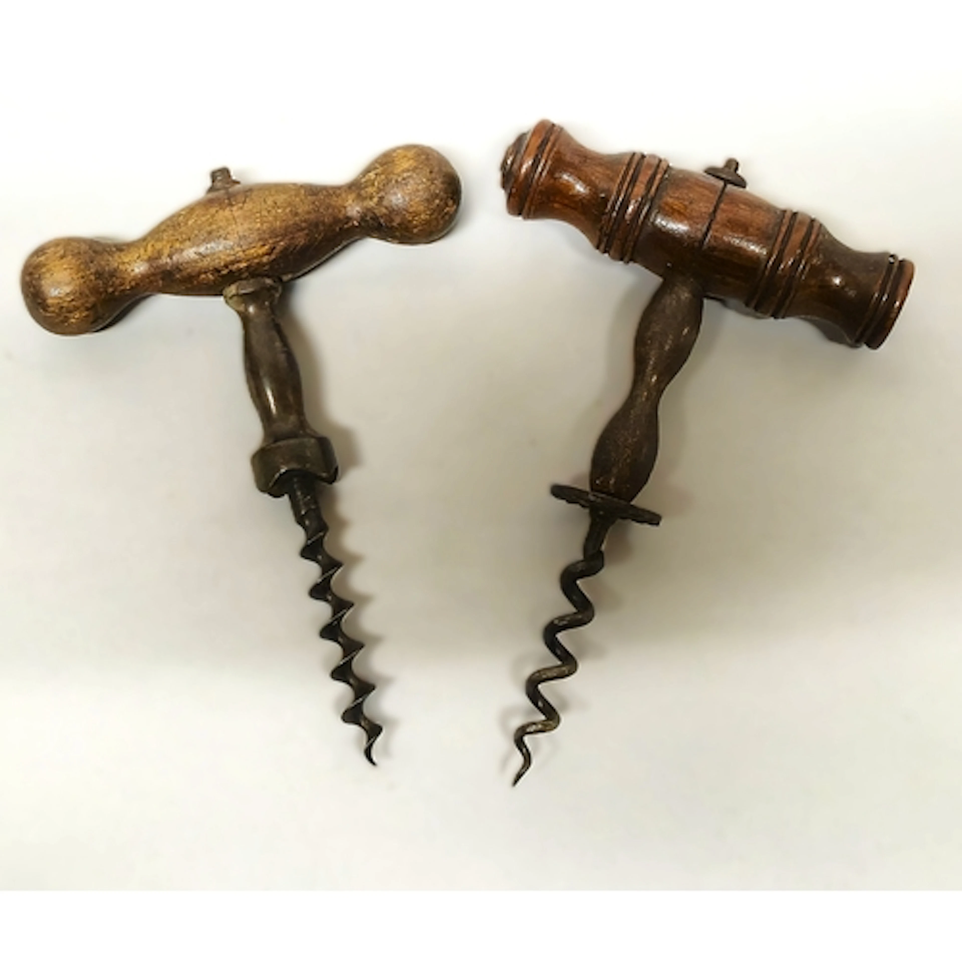 Antique pull metal corkscrew with turned wood handle, and an...