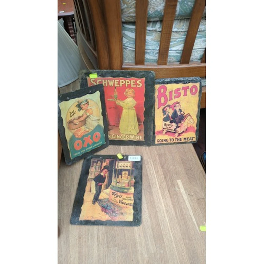 Four slate advertising plaques with printed illustrations fo...