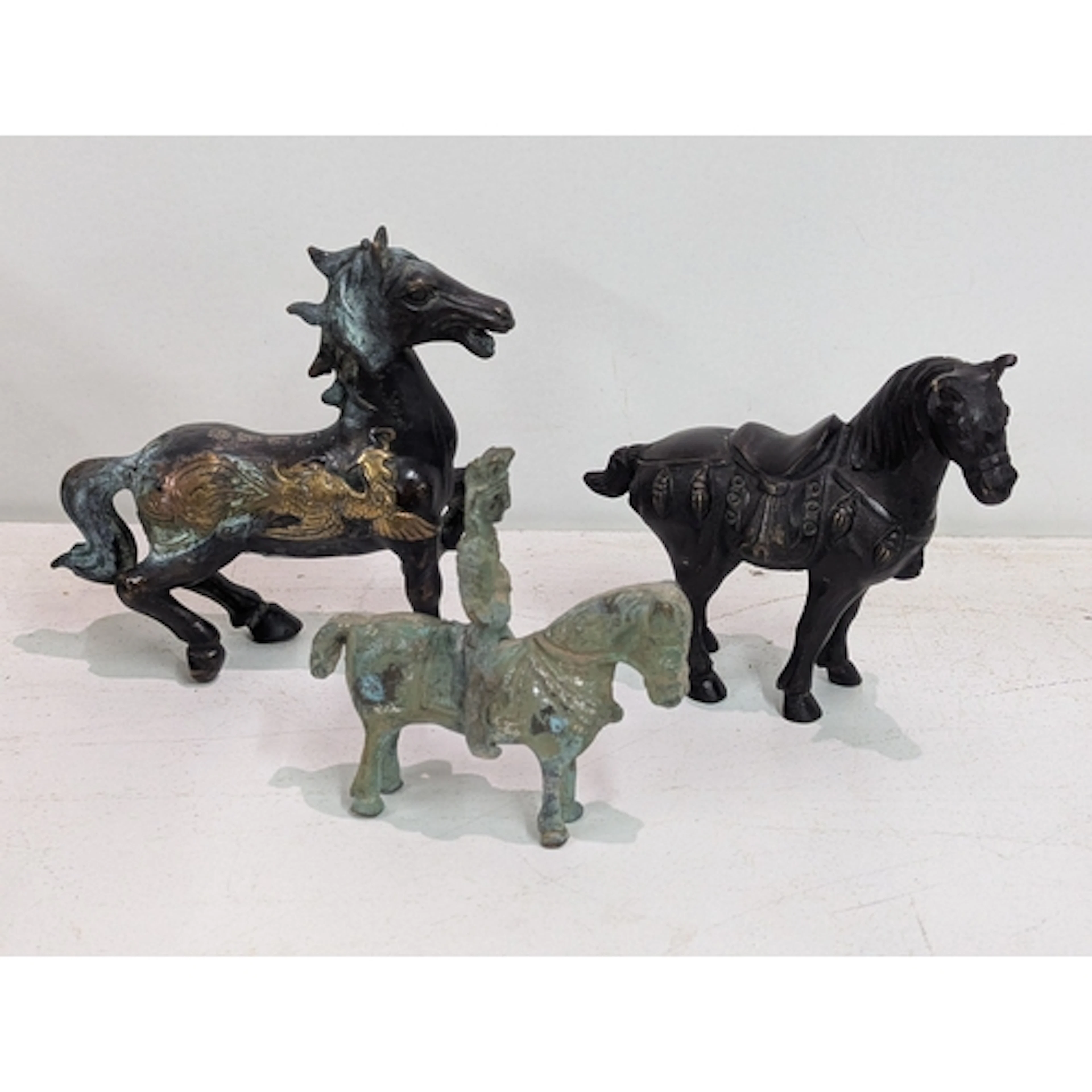 Three horse sculptures to include two bronze examples, one m...