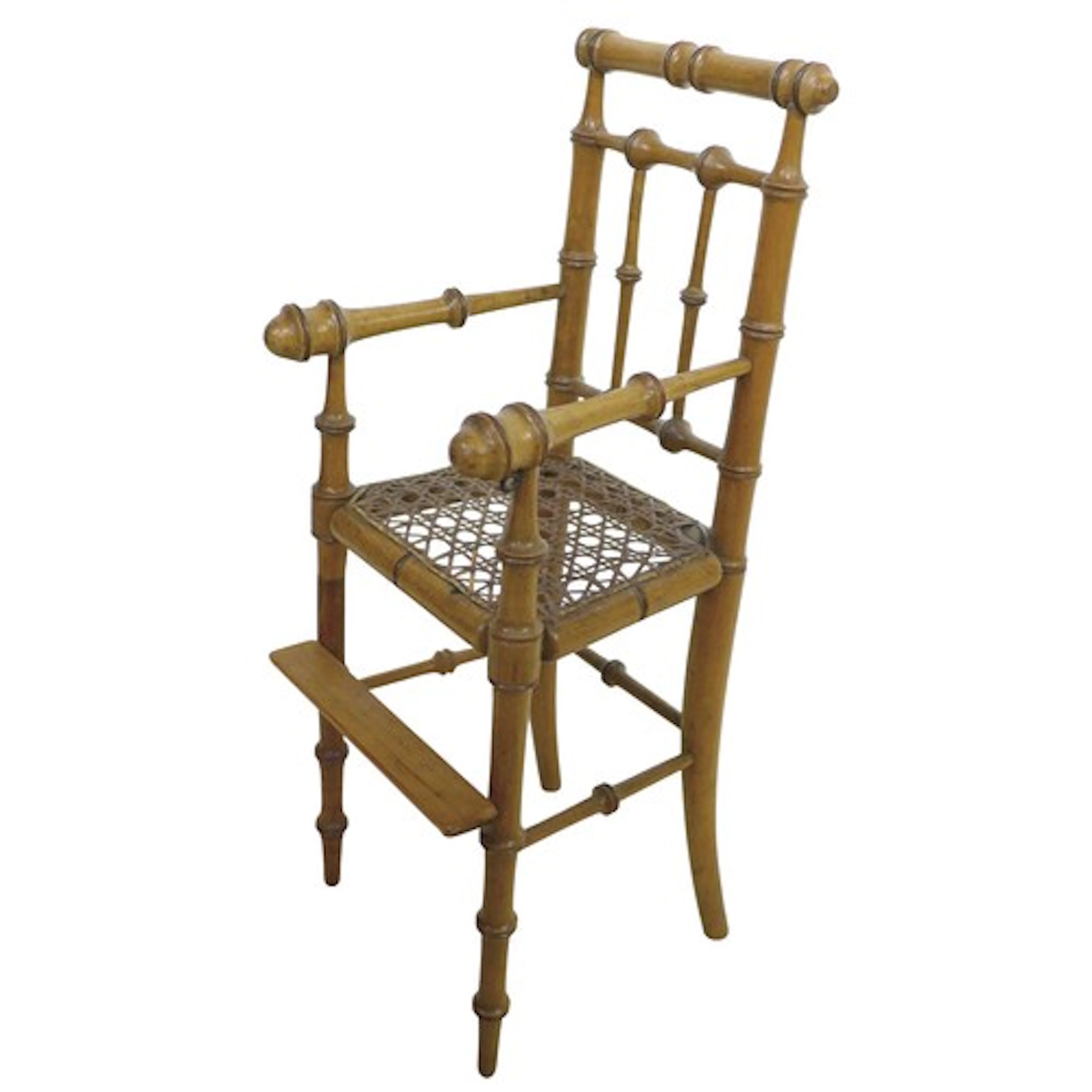 A Victorian style faux bamboo dolls highchair with a cane se...