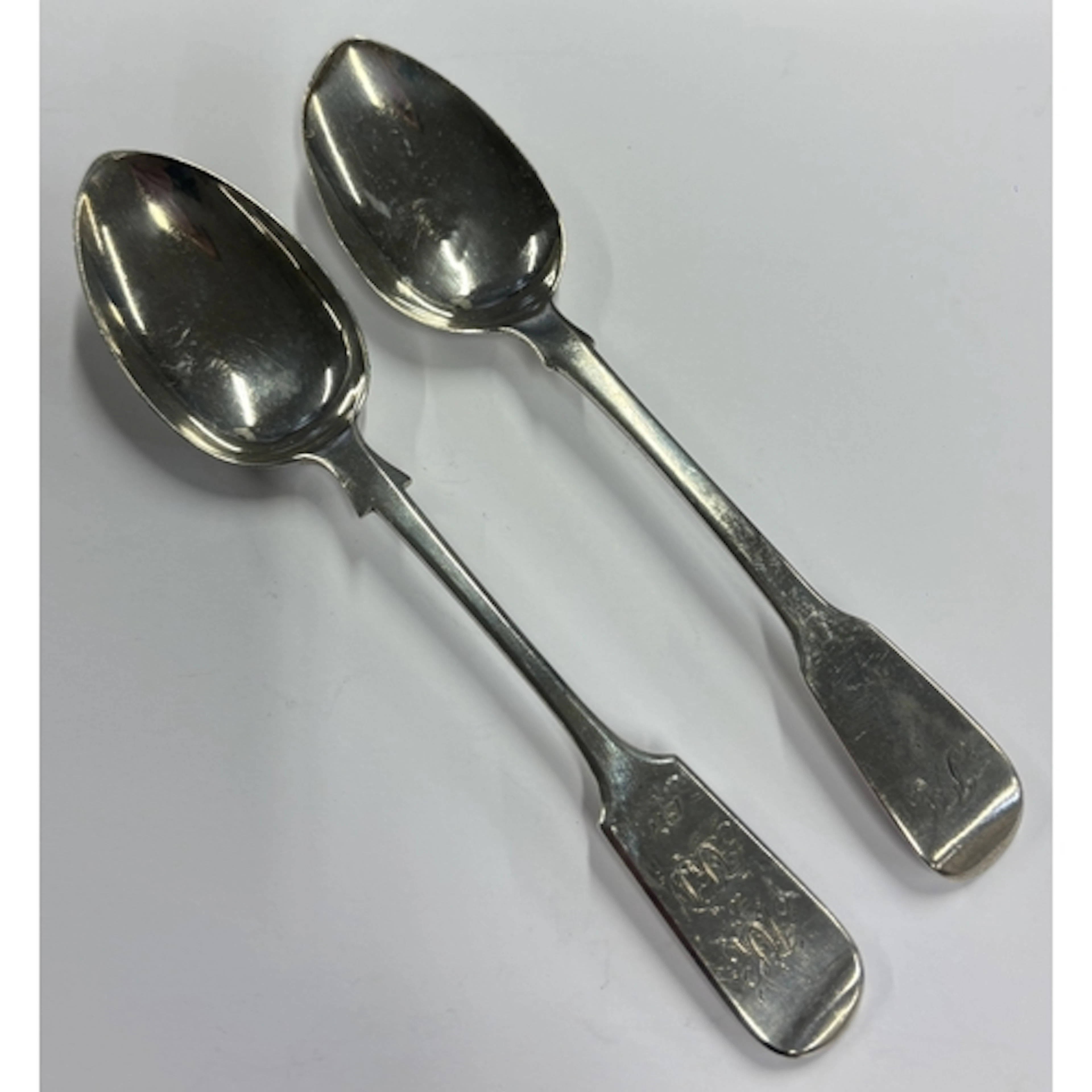 Two Georgian silver fiddle pattern dessert spoons. Various d...