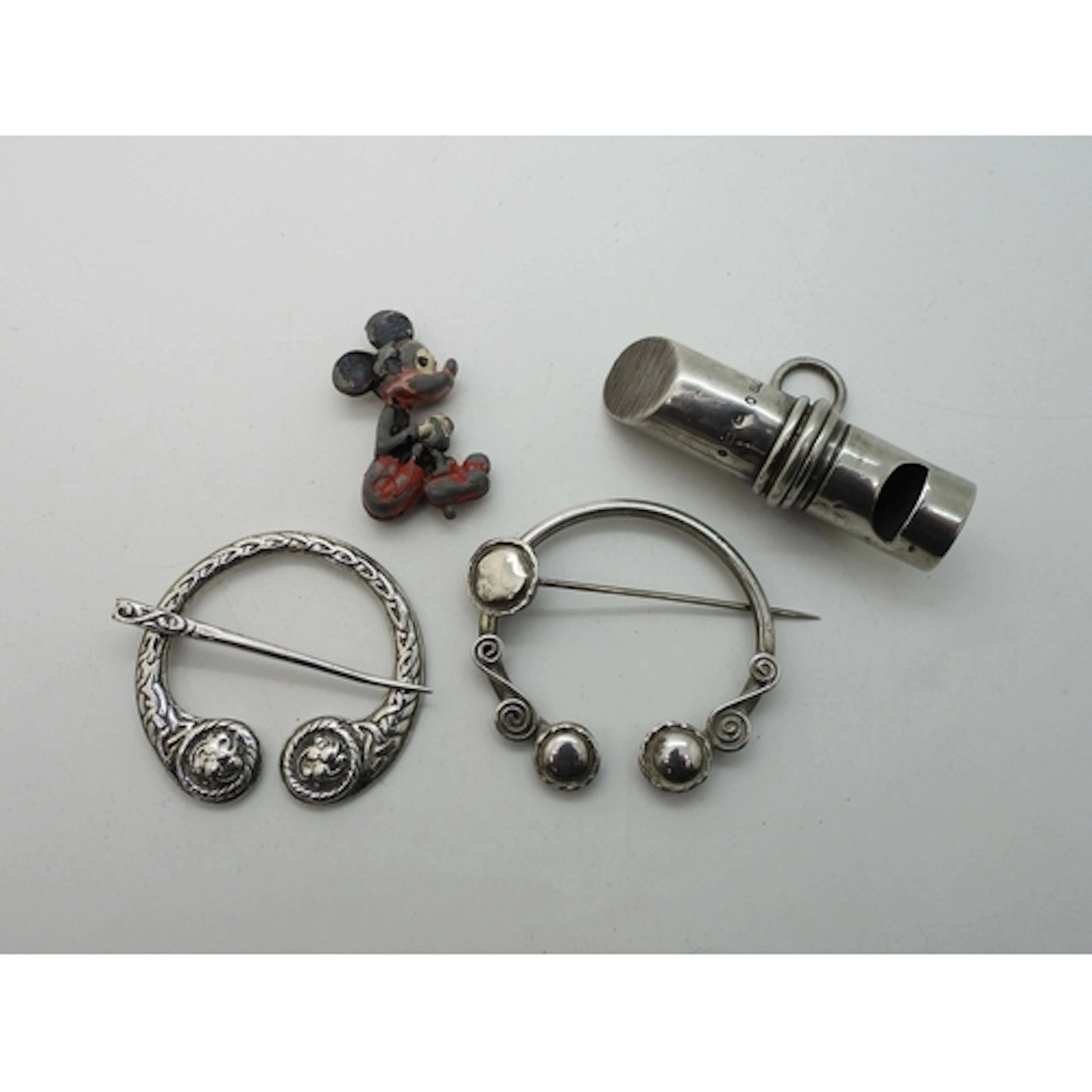 Two silver pen annular brooches, one made by Henderson &...