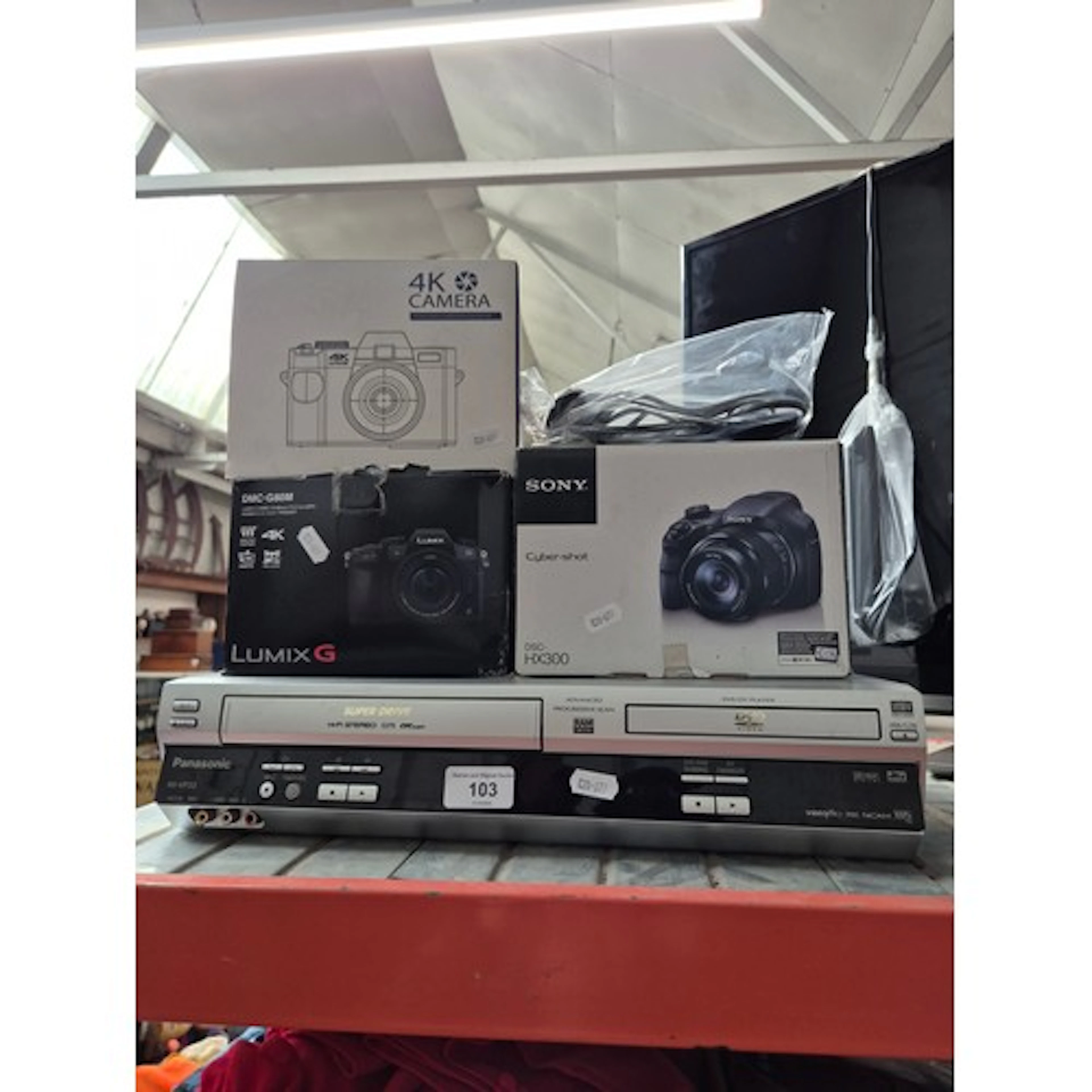 A group of three cameras (Sony Cyber-shot DSC-HX300, Panason...