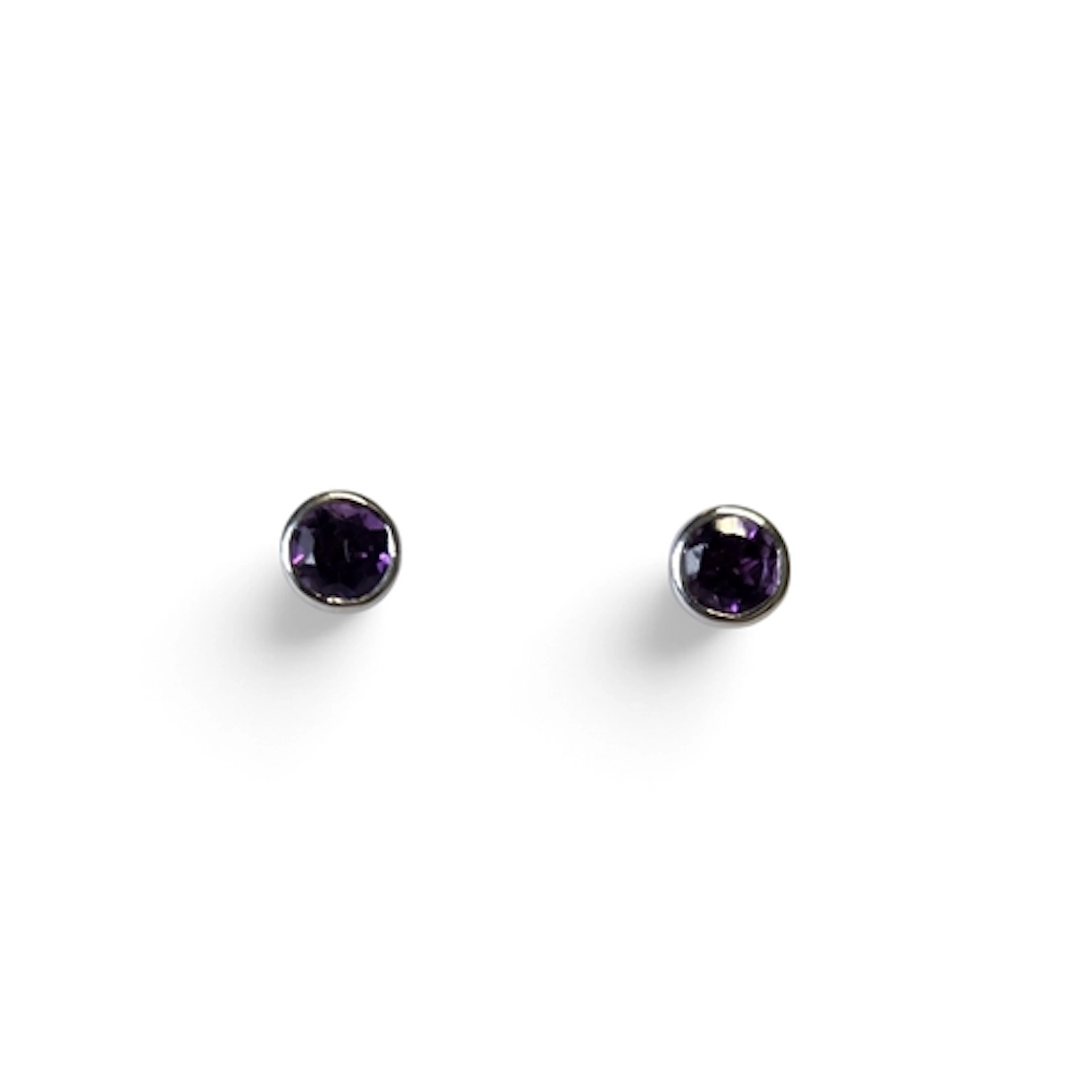 A pair of 9ct Gold and Amethyst stud Earrings.