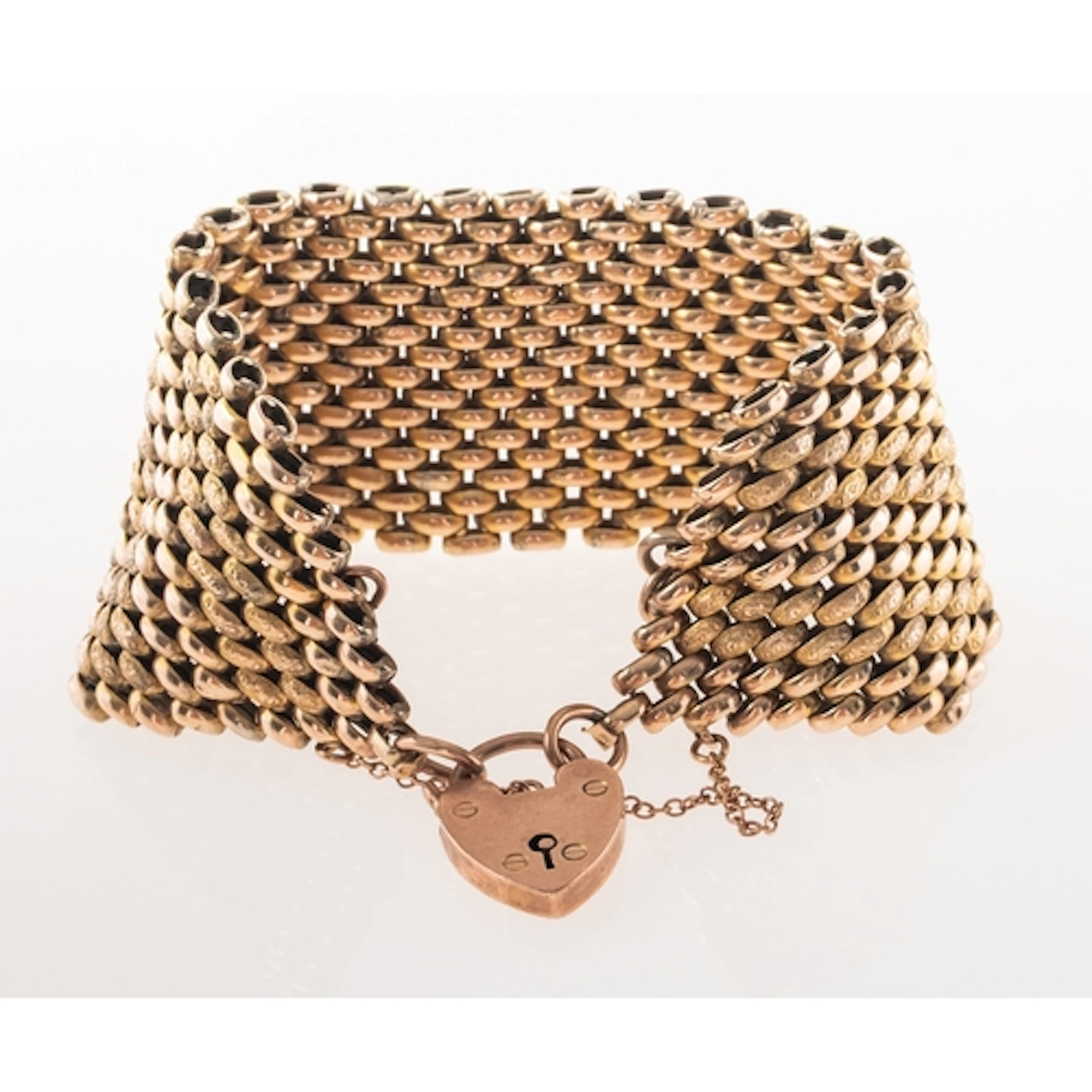 An antique mesh link bracelet, with heart padlock and safety...