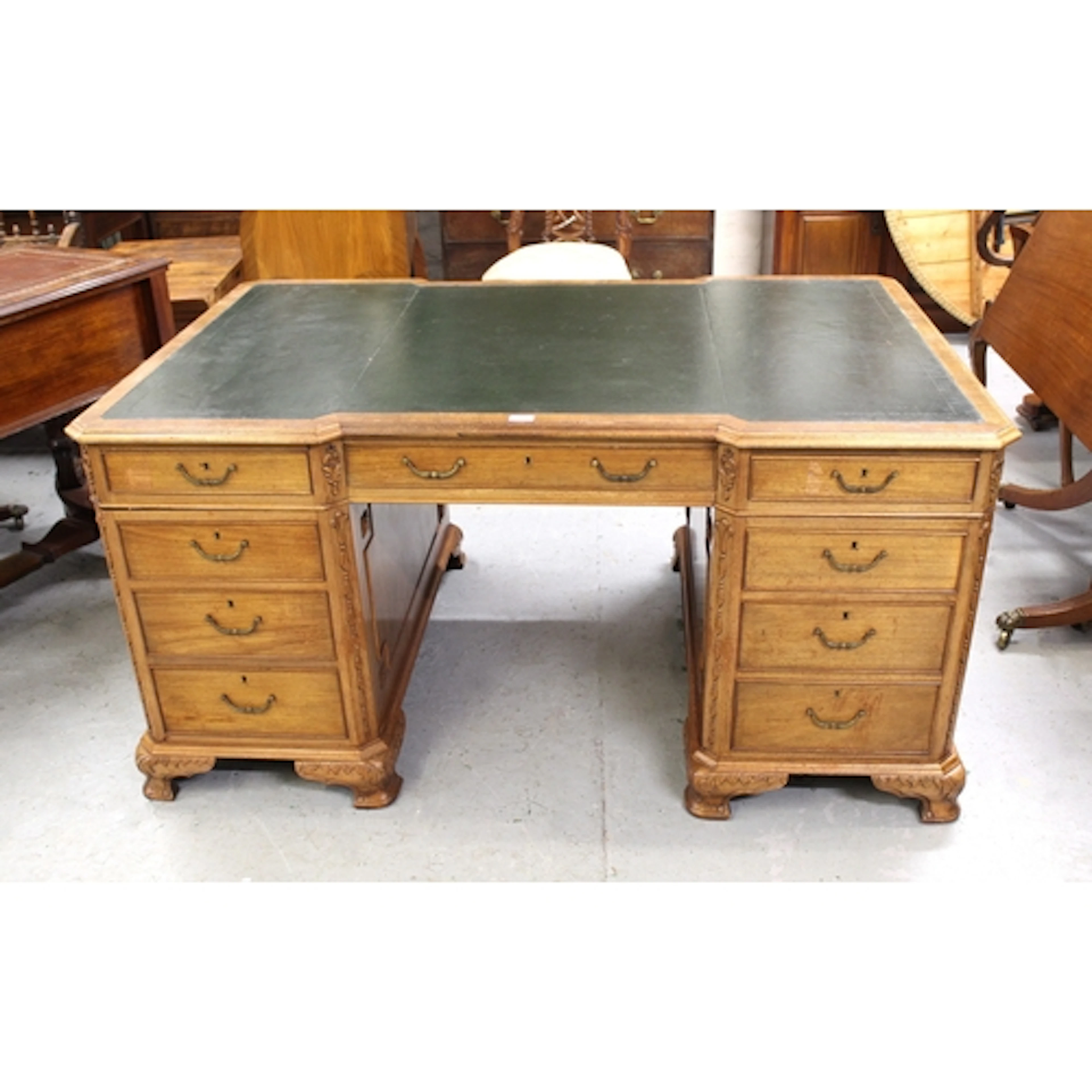 Large mahogany partners desk, the leather inset top above an...