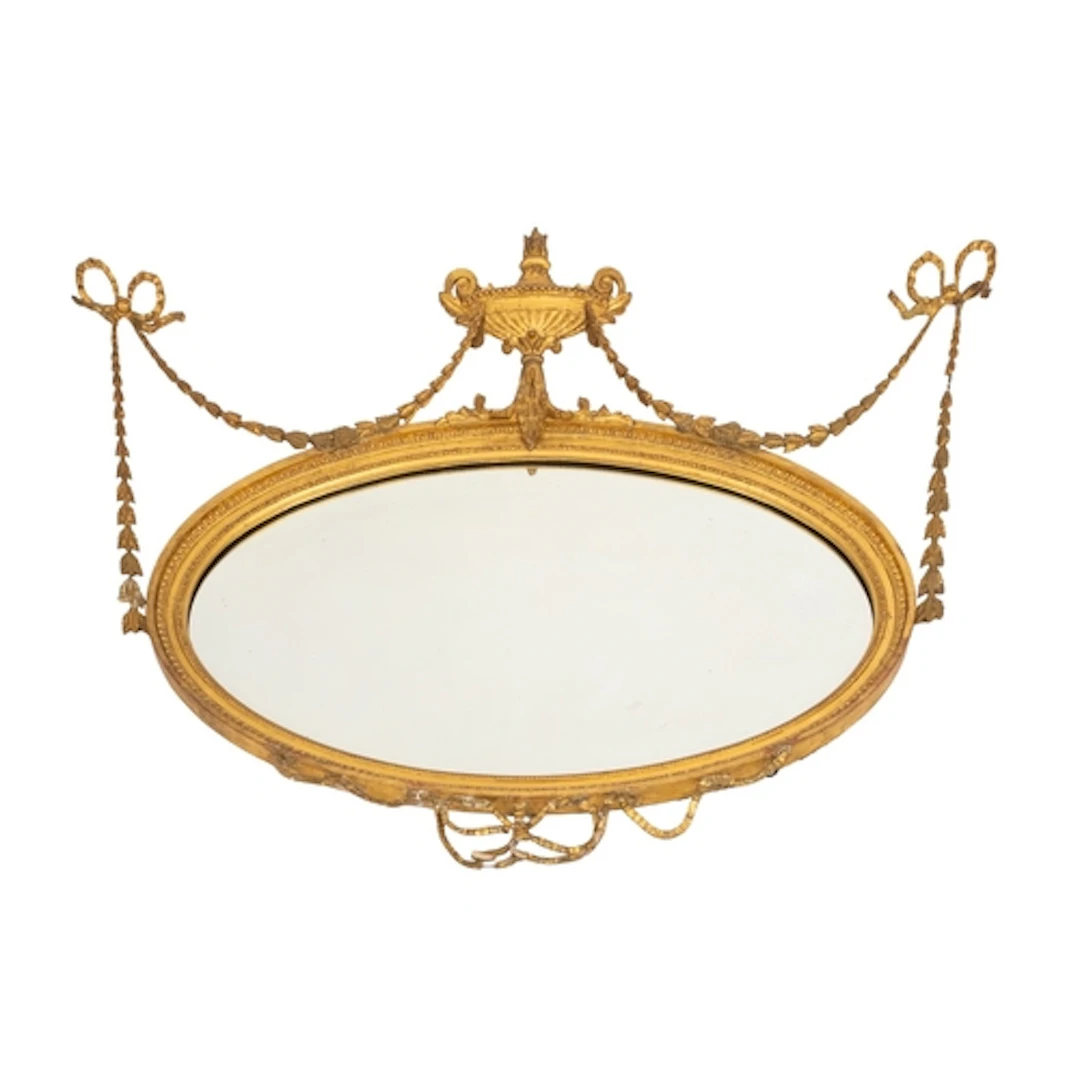 A giltwood and composition framed oval wall mirror, in Adam ...