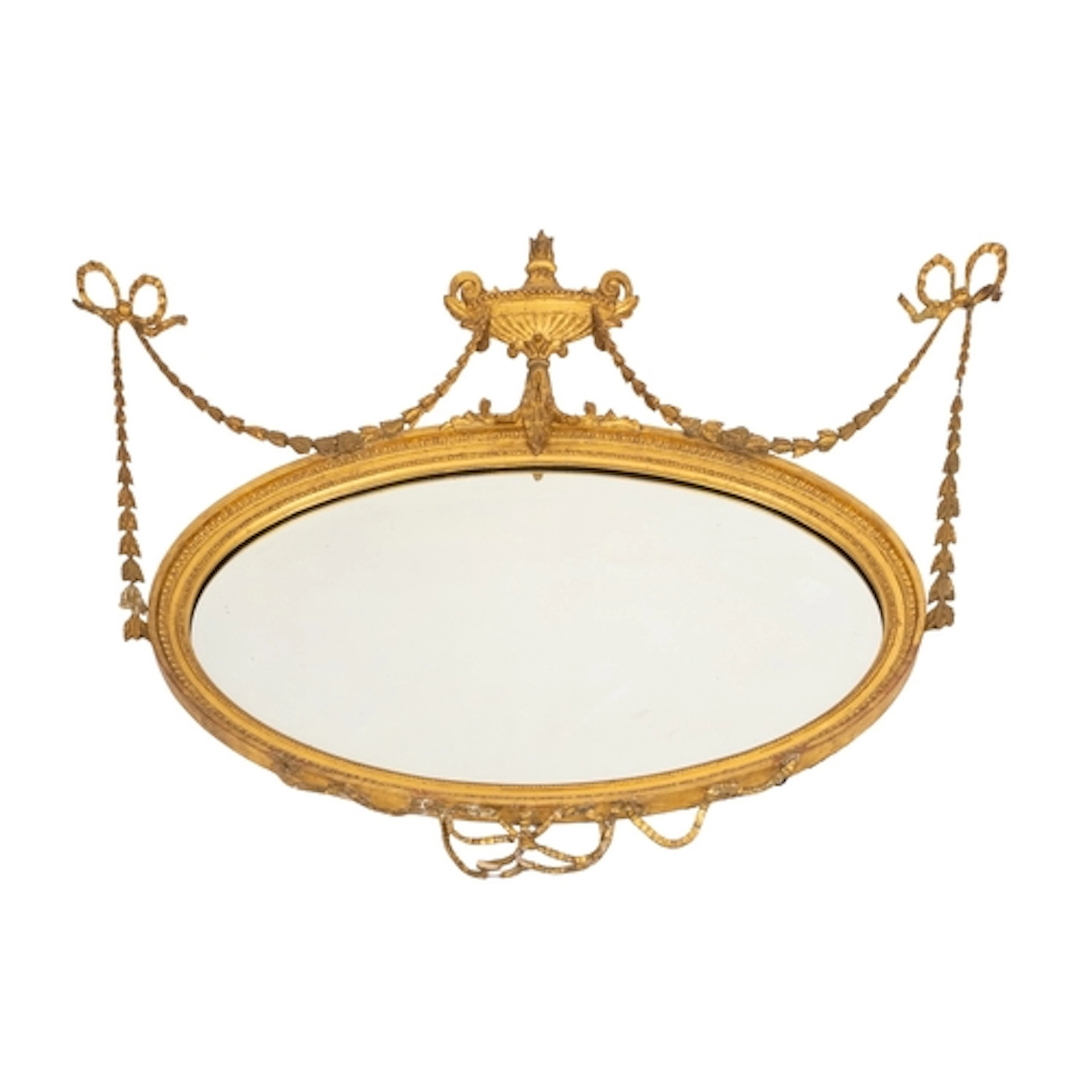 A giltwood and composition framed oval wall mirror, in Adam ...