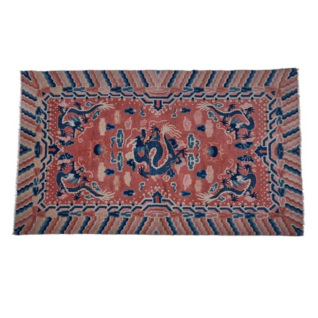 A GOOD, PROBABLY IMPERIAL, CHINESE PINK-GROUND DRAGON CARPET...