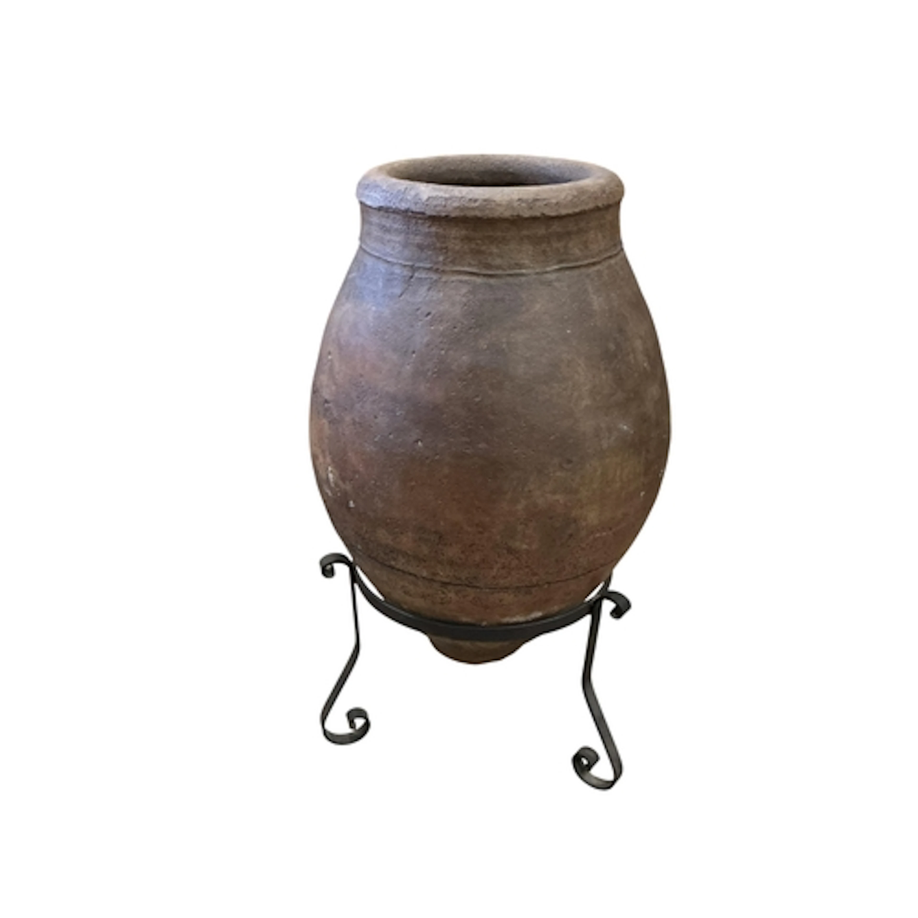 A large Spanish terracotta oil jar, on wrought iron stand, h...