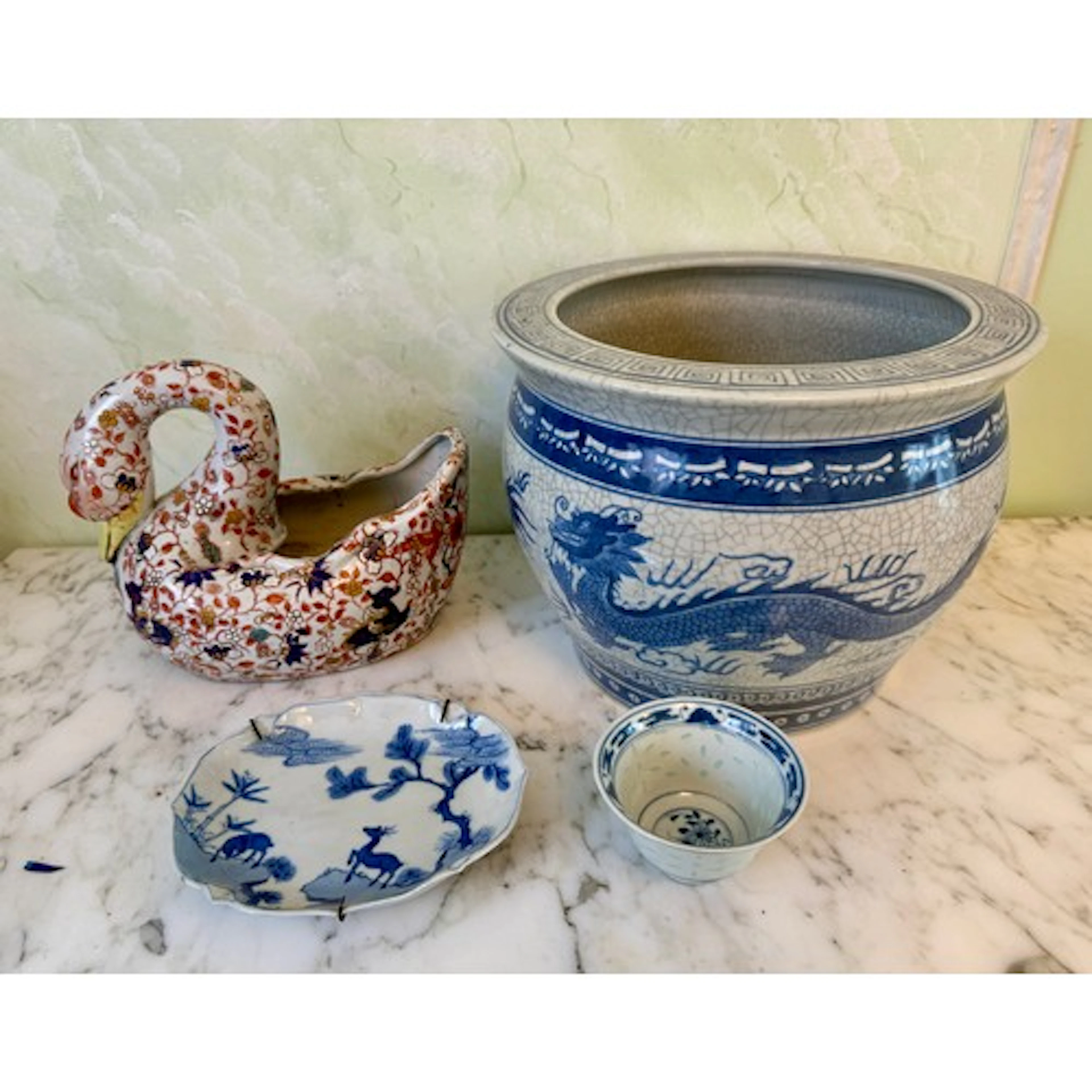 Four pieces of oriental ceramics, three marked to base, to i...