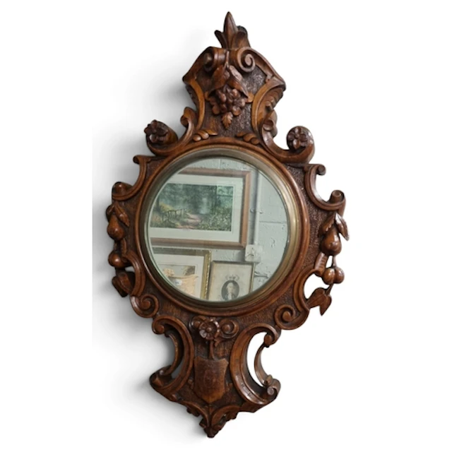 A good 19th Century heavily carved Walnut Wall Mirror in the...