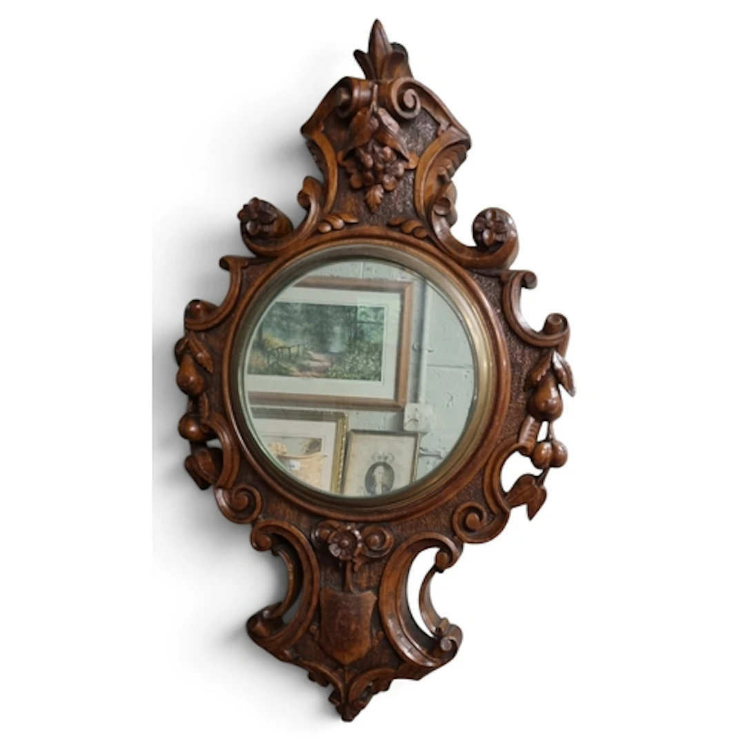 A good 19th Century heavily carved Walnut Wall Mirror in the...