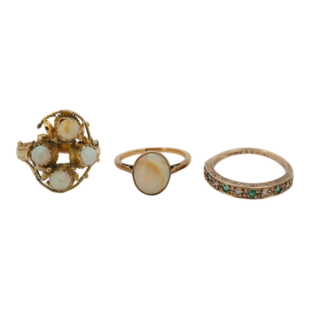 Two unmarked yellow metal and opal rings, including a cluste...