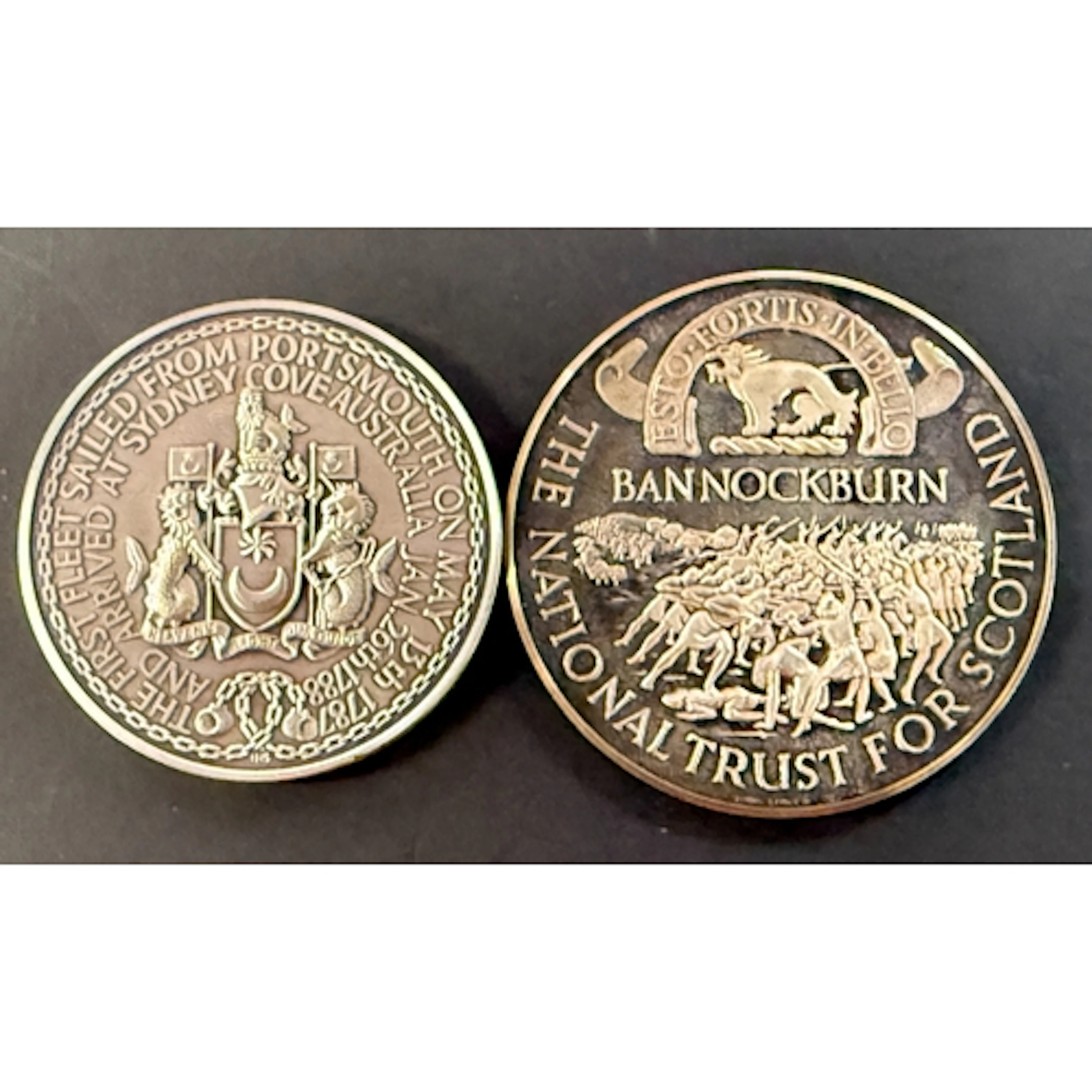 A pair of sterling silver commemorative medallions, comprisi...