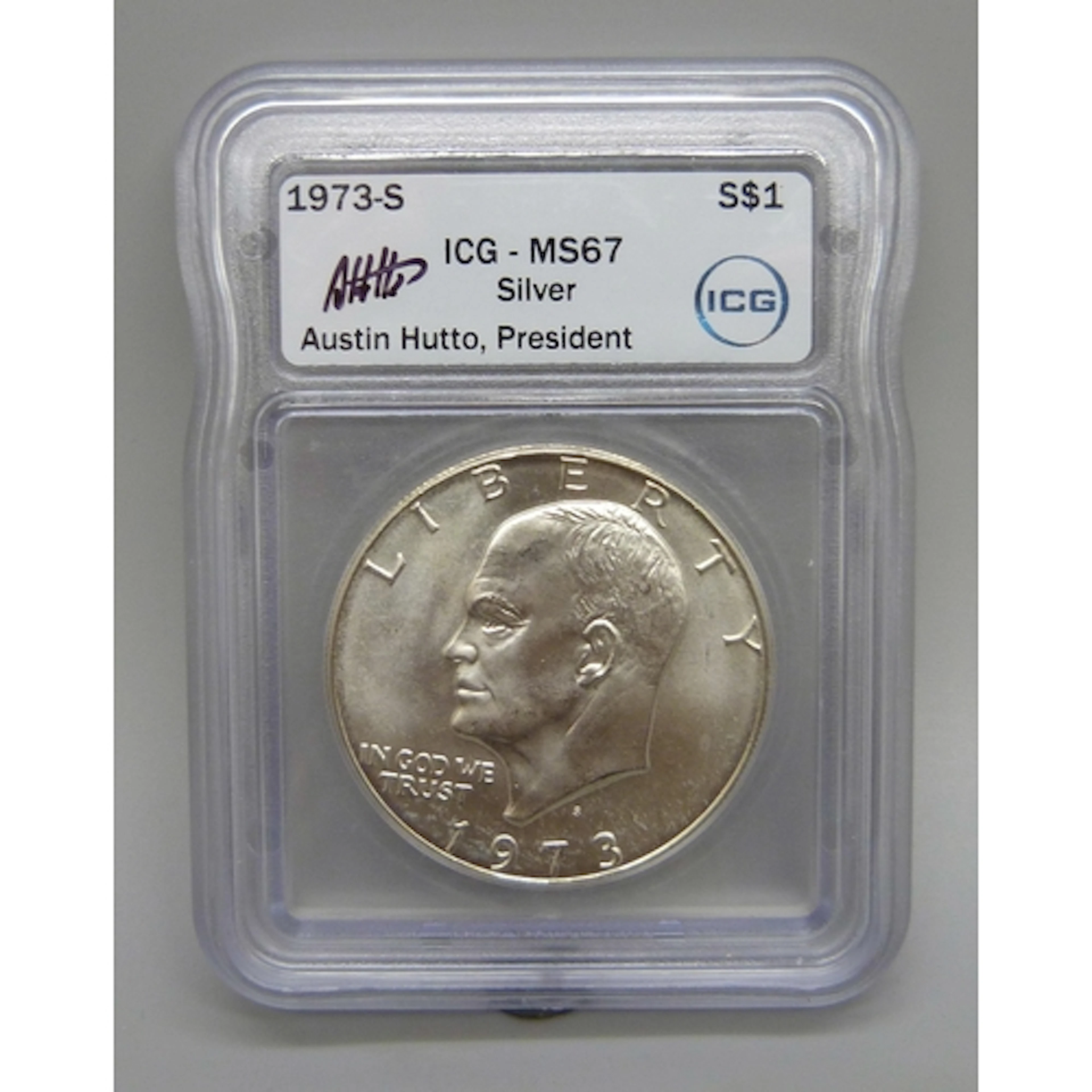A 1973 USA Liberty one dollar coin, the ICG case hand signed...