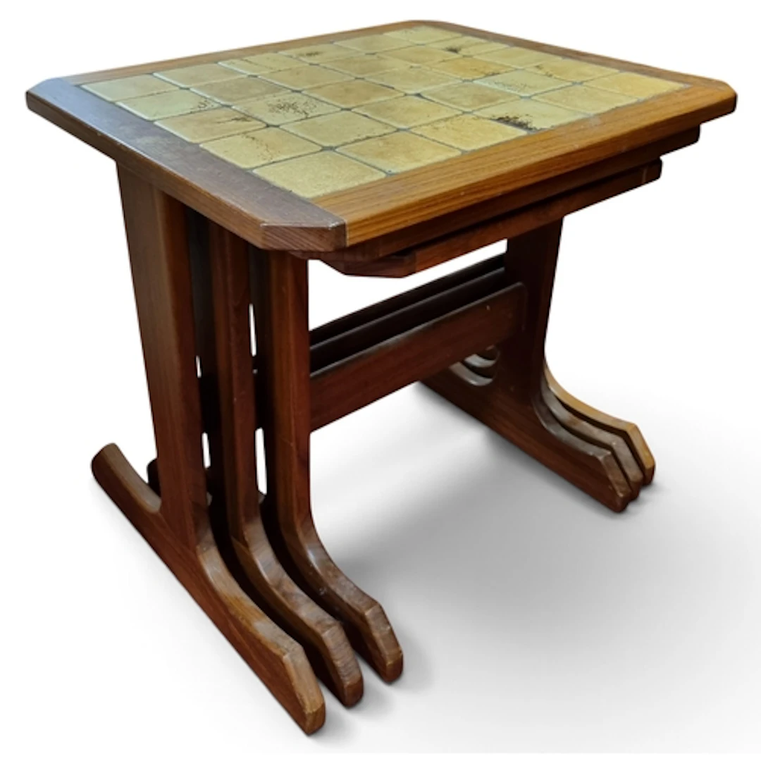 A nest of three mid Century Tables with Tiled tops. W 50 x D...