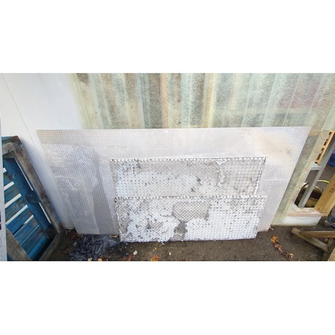 Three rectangular aluminium chequer-plate sheets of varying ...