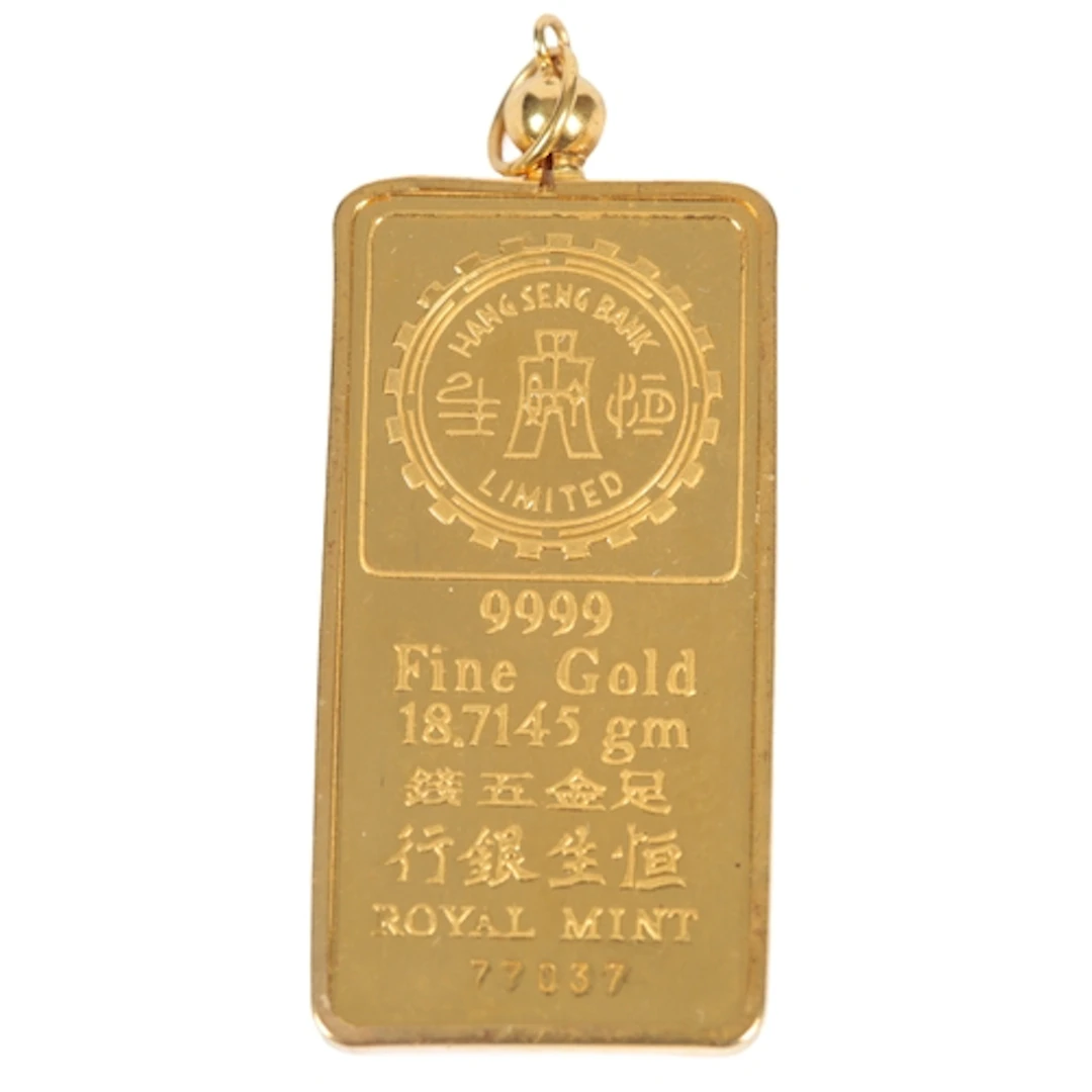 A gold ingot pendant, of rectangular outline, stamped Hang S...