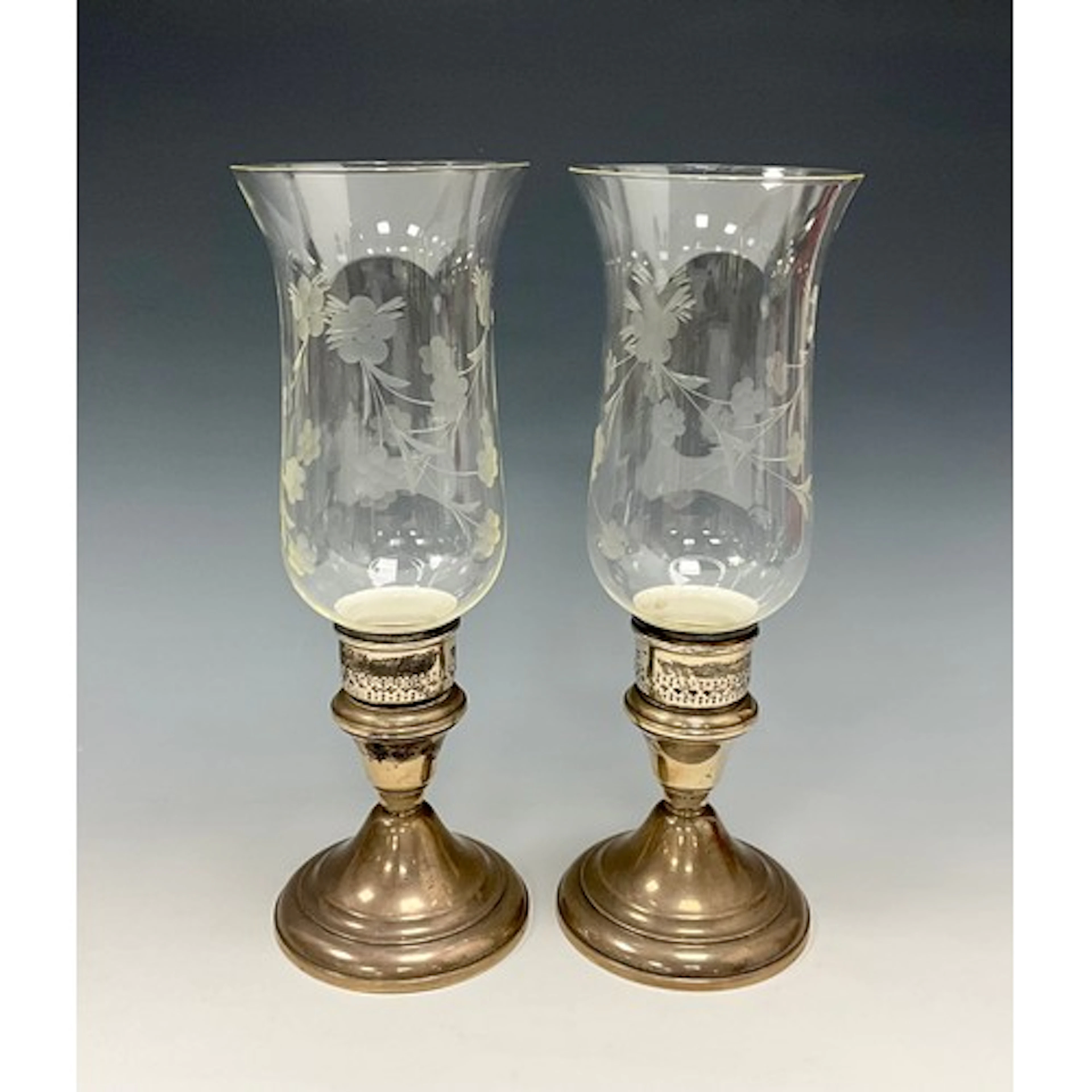 A pair of American silver candle lanterns, etched glass stor...