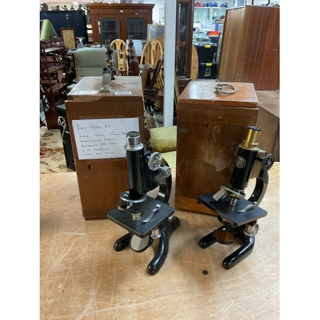 Beck model 29 microscope in case.and a C Baker 12665 in case...