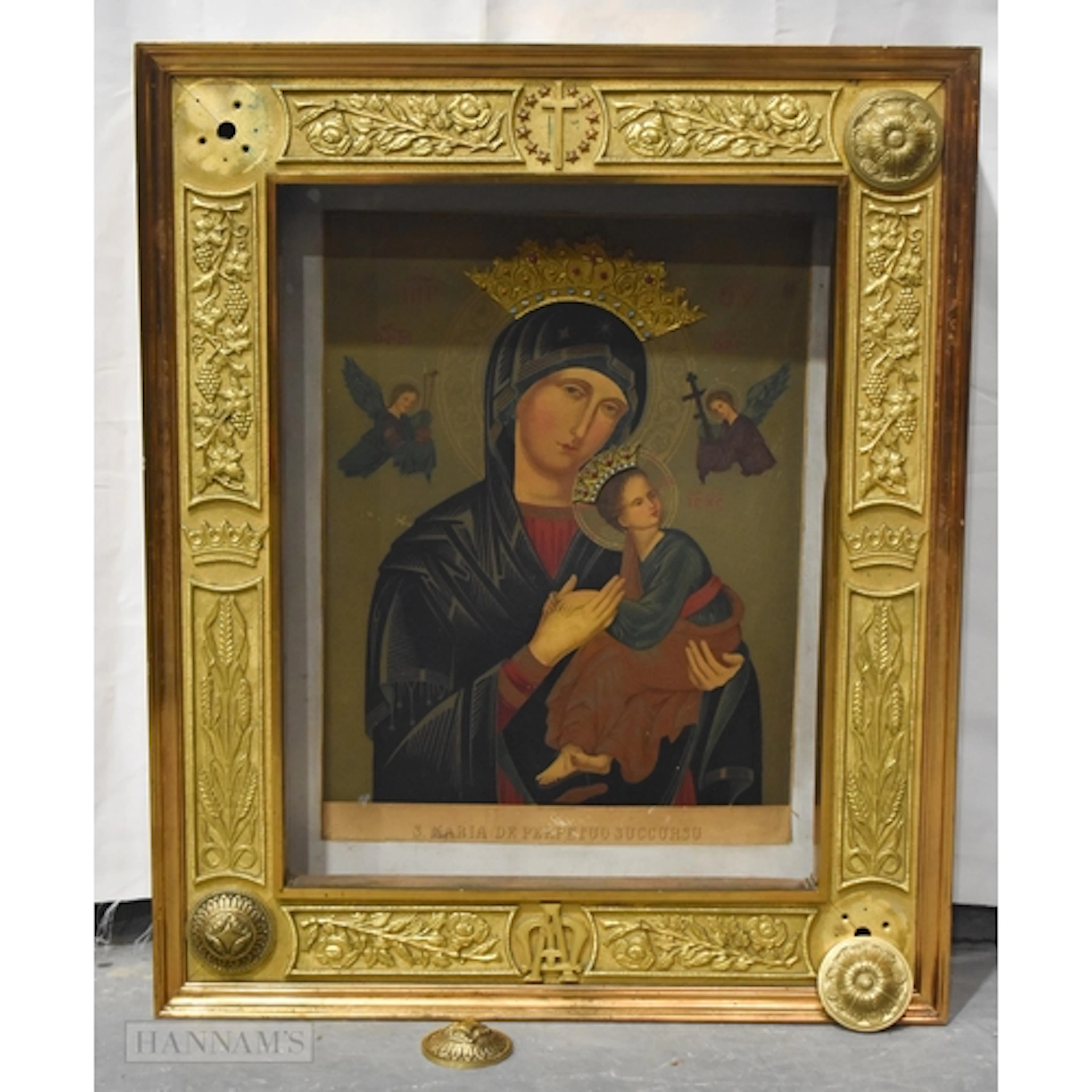 A LARGE RUSSIAN ICON contained within a heavy bronze frame. ...
