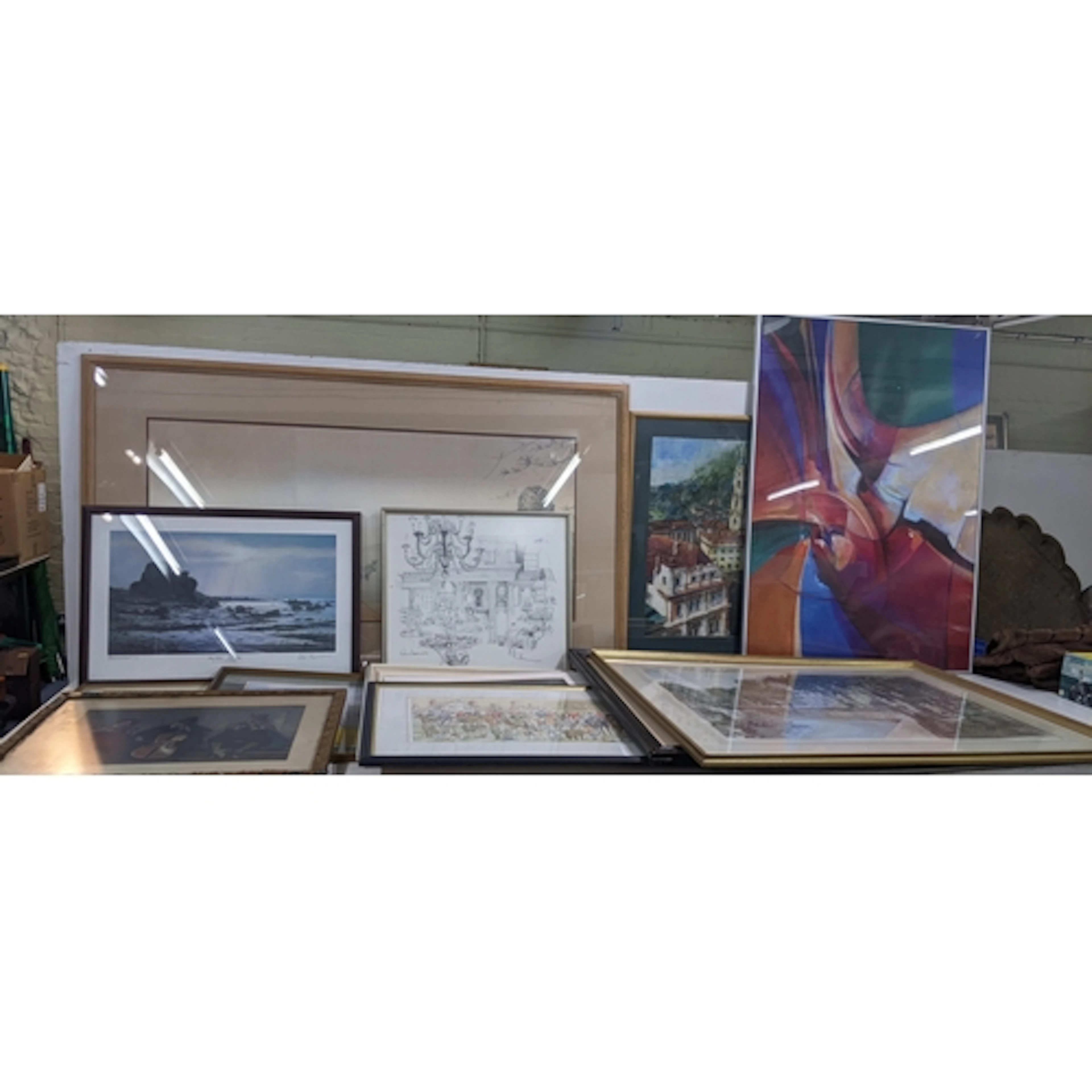 A collection of wall-art to include a pastel featuring a gol...