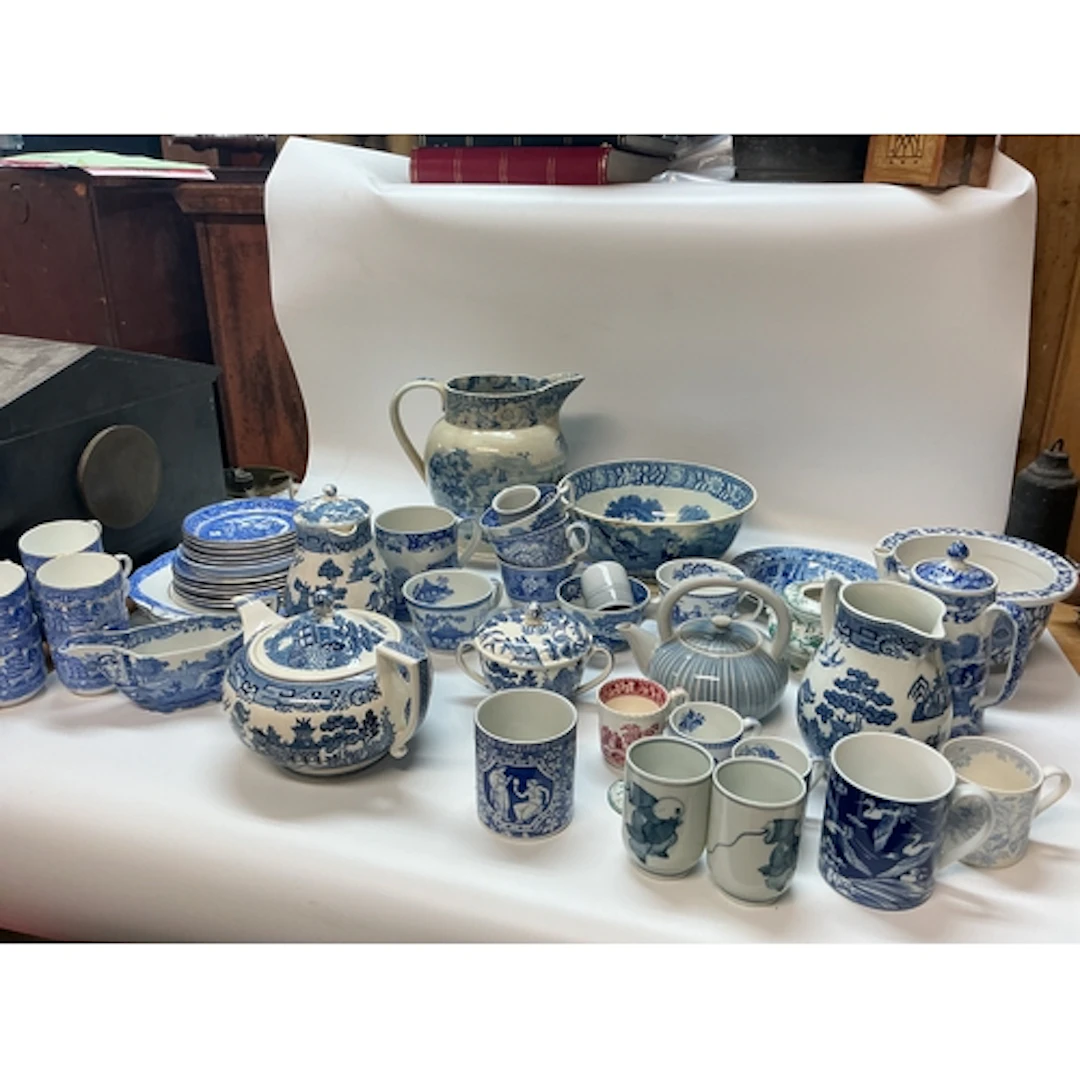 A collection of blue and white ceramics including plates, cu...