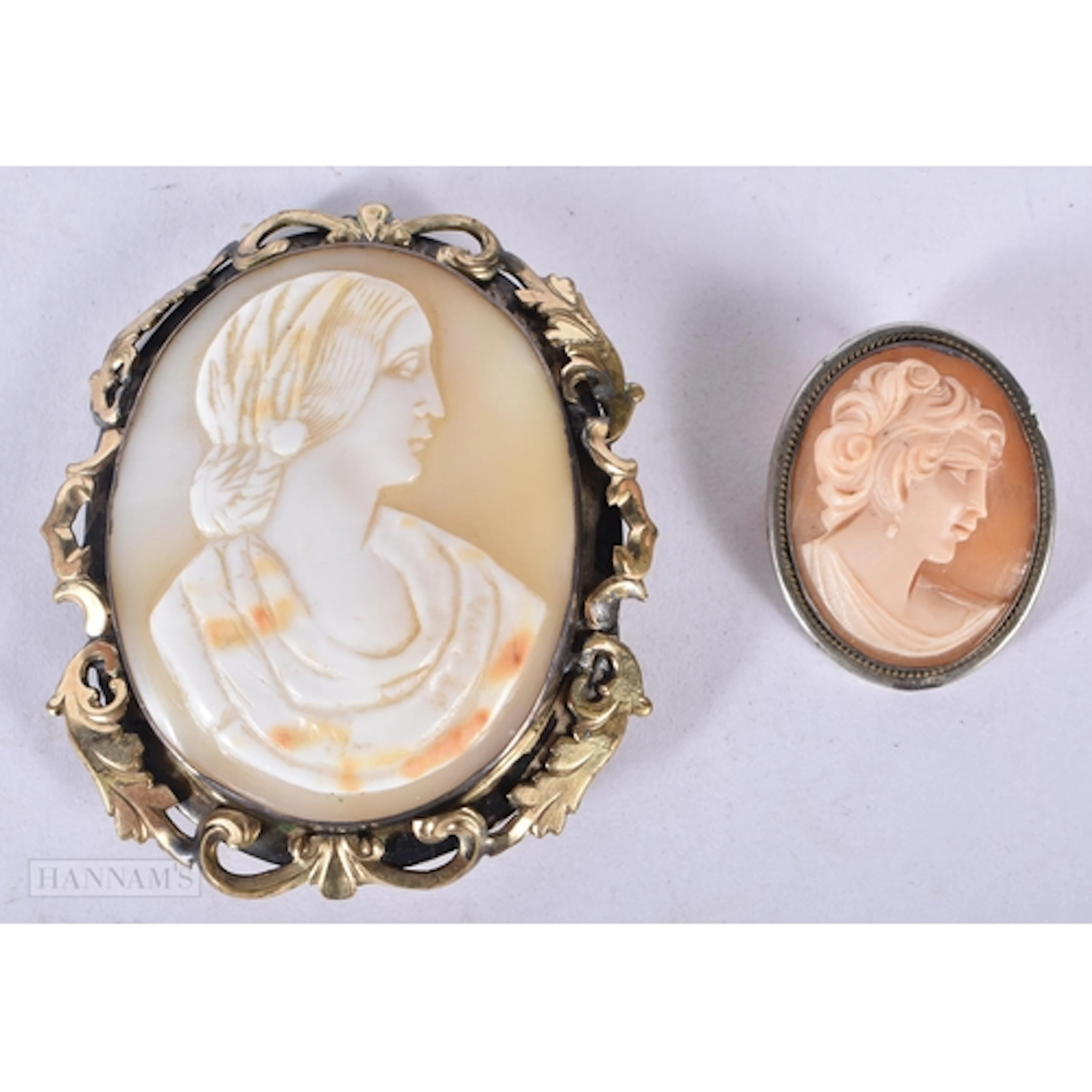 Two antique Cameo brooches one with silver frame 5.5cm (2)