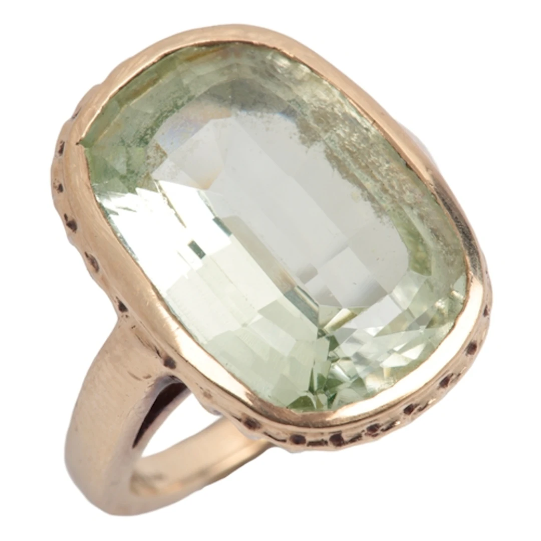 A synthetic green spinel cocktail ring, collet-set with an e...
