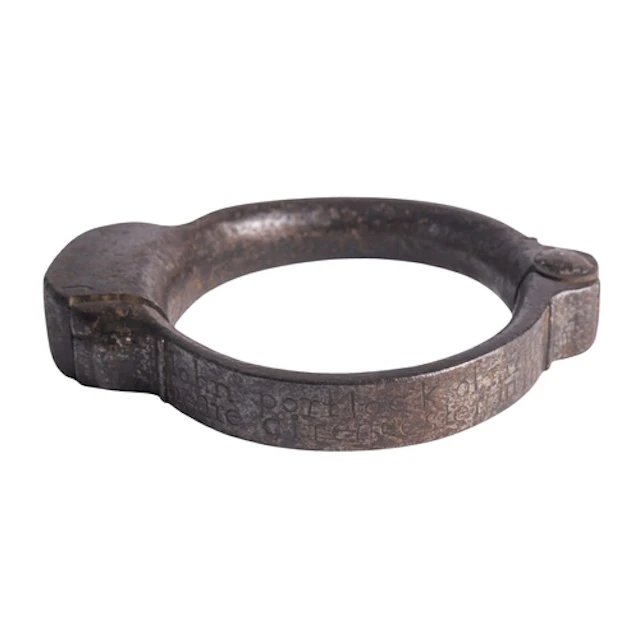 An early 18th century steel handcuff inscribed 'John Portloc...