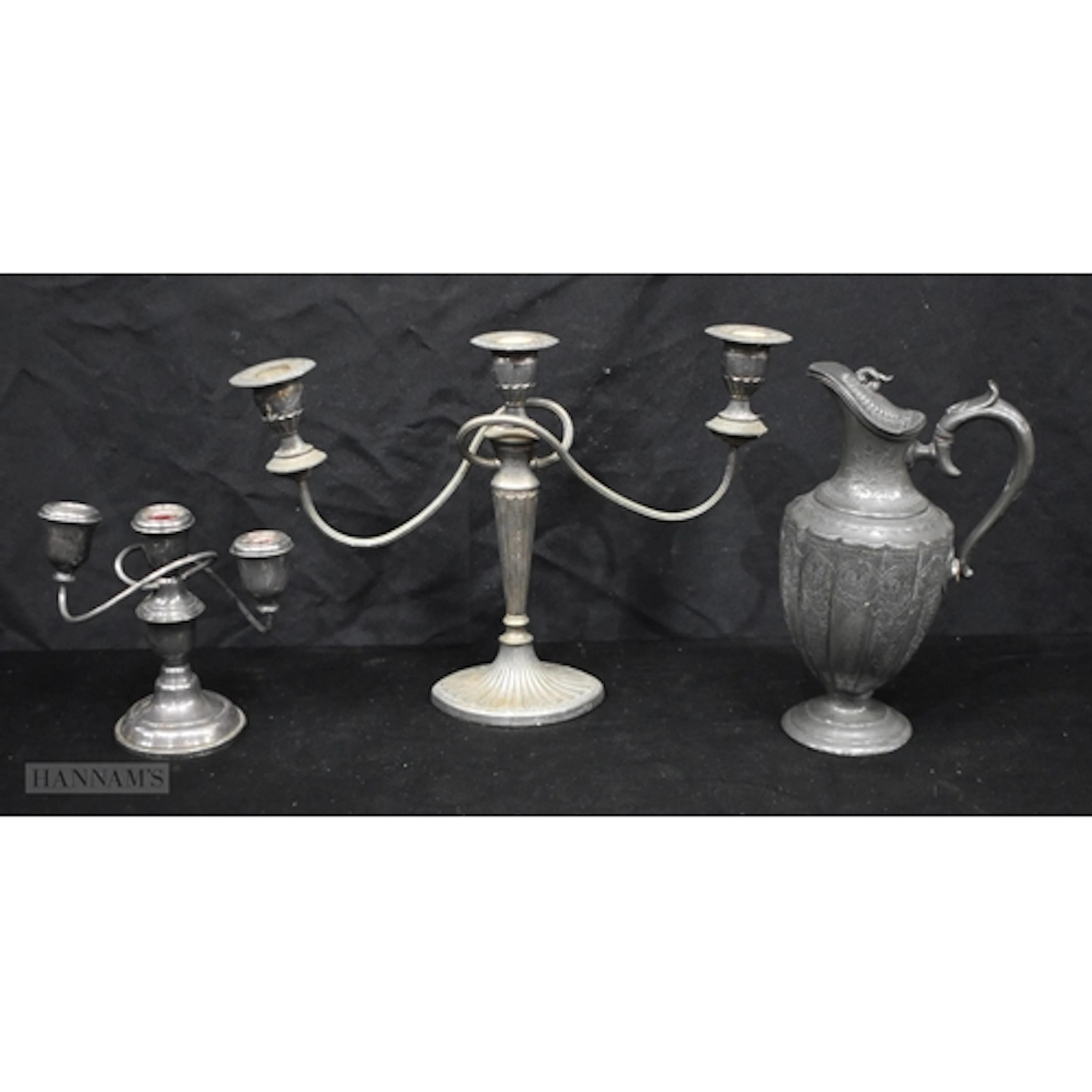 An antique silver plate Ewer together with two candelabra 28...