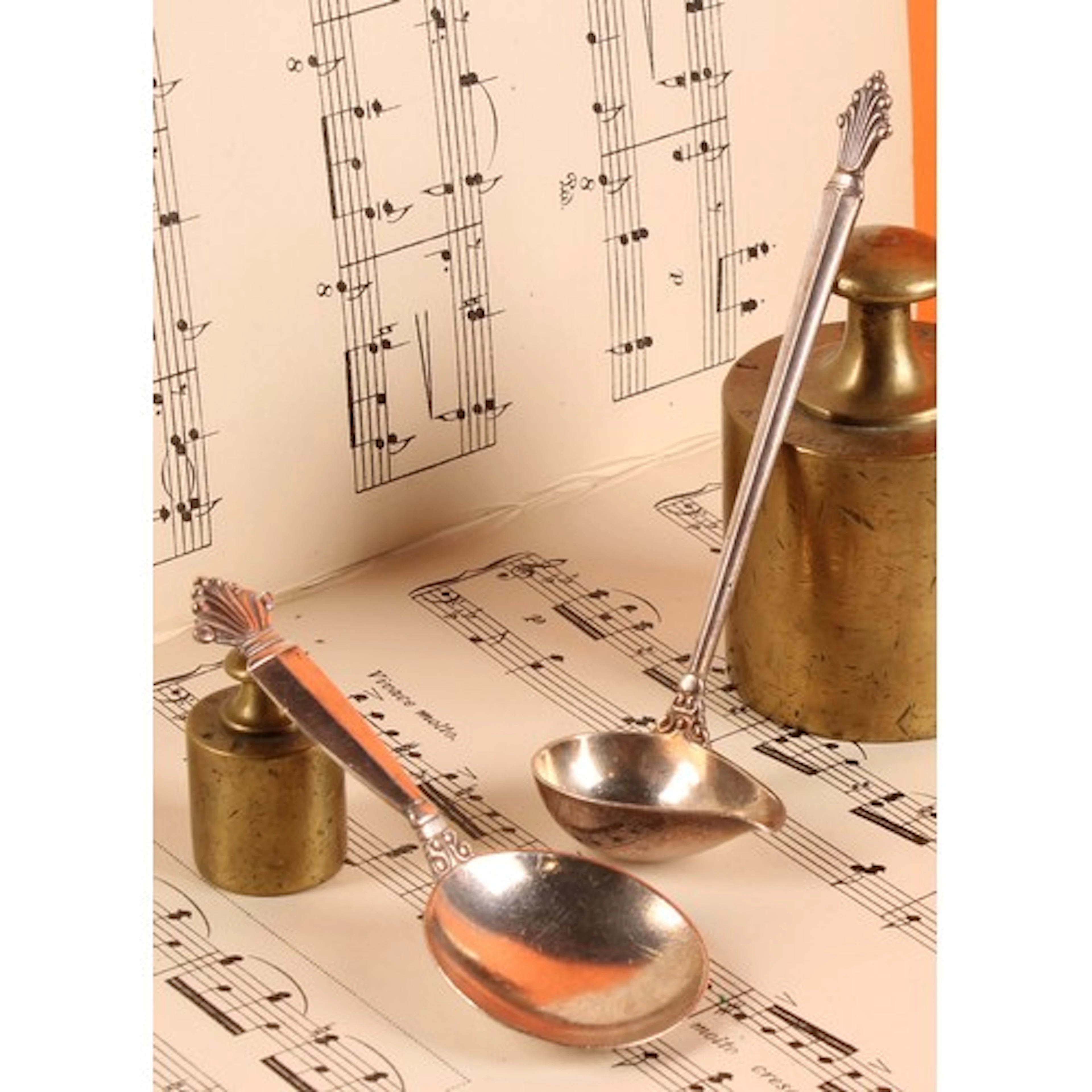 Georg Jensen - a silver caddy spoon and sauce ladle, each w...