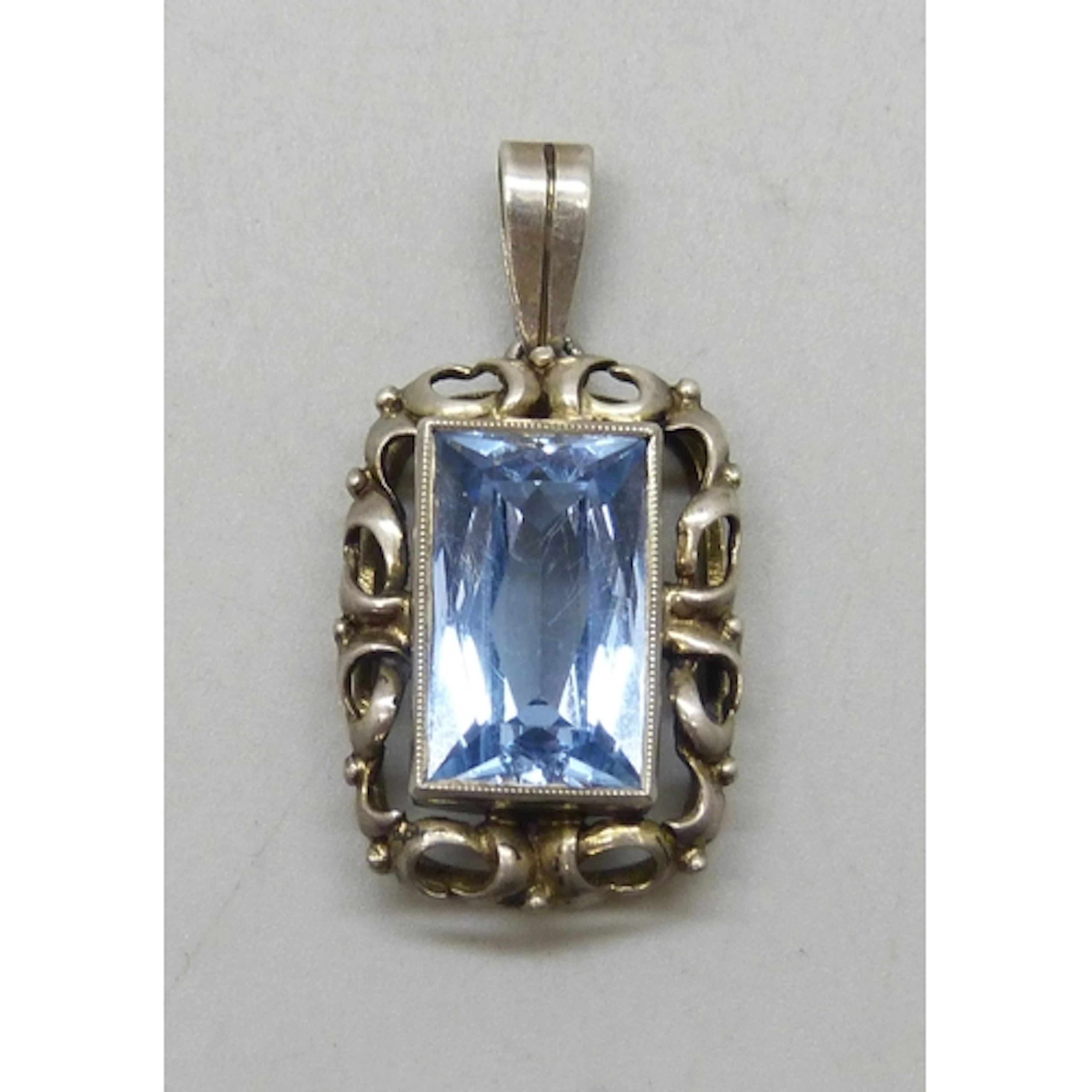 An Art Deco Continental .830 silver and topaz necklace penda...