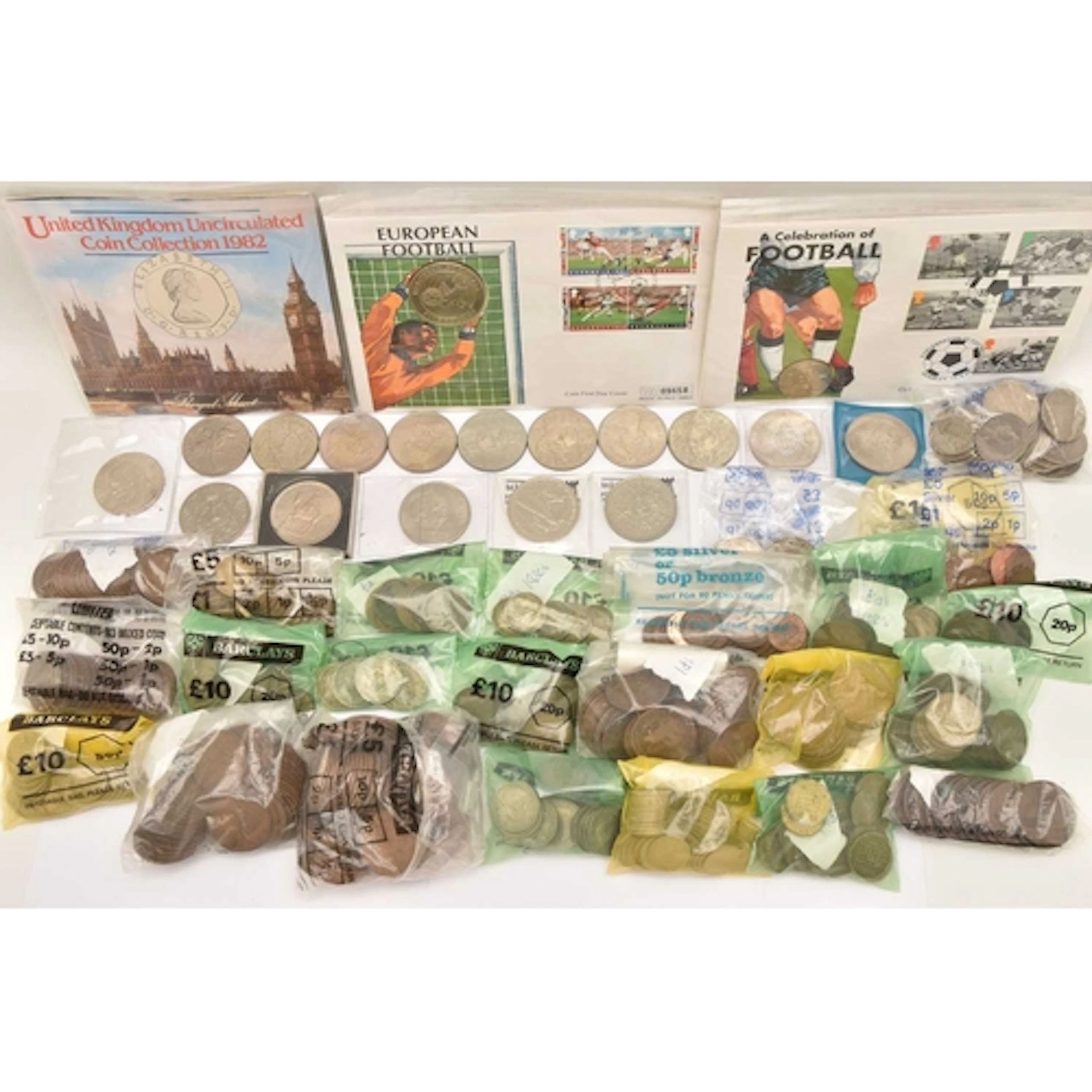 A large box containing bagged quantities of UK coins. There ...