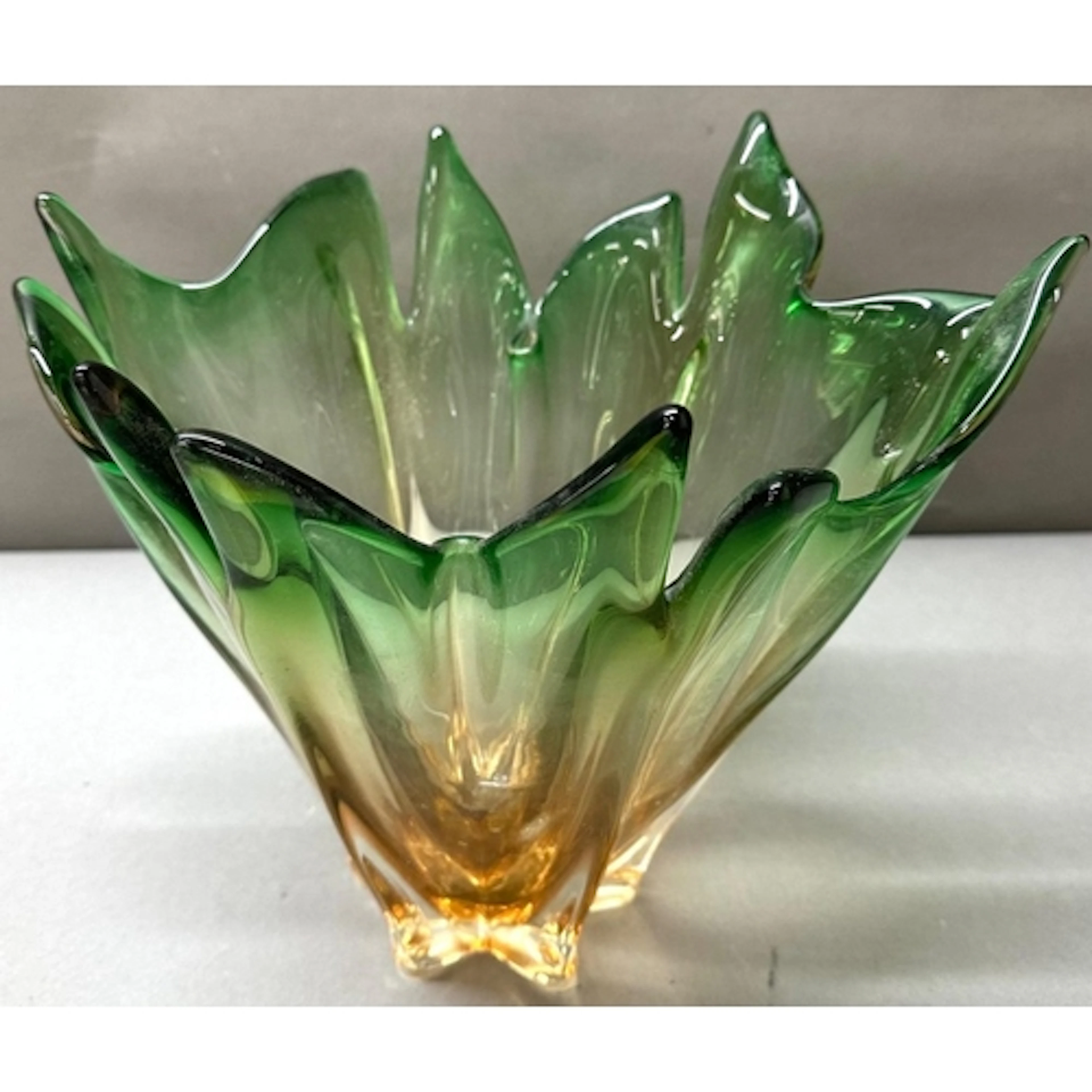 A Japanese style glass bowl designed with green and orange g...