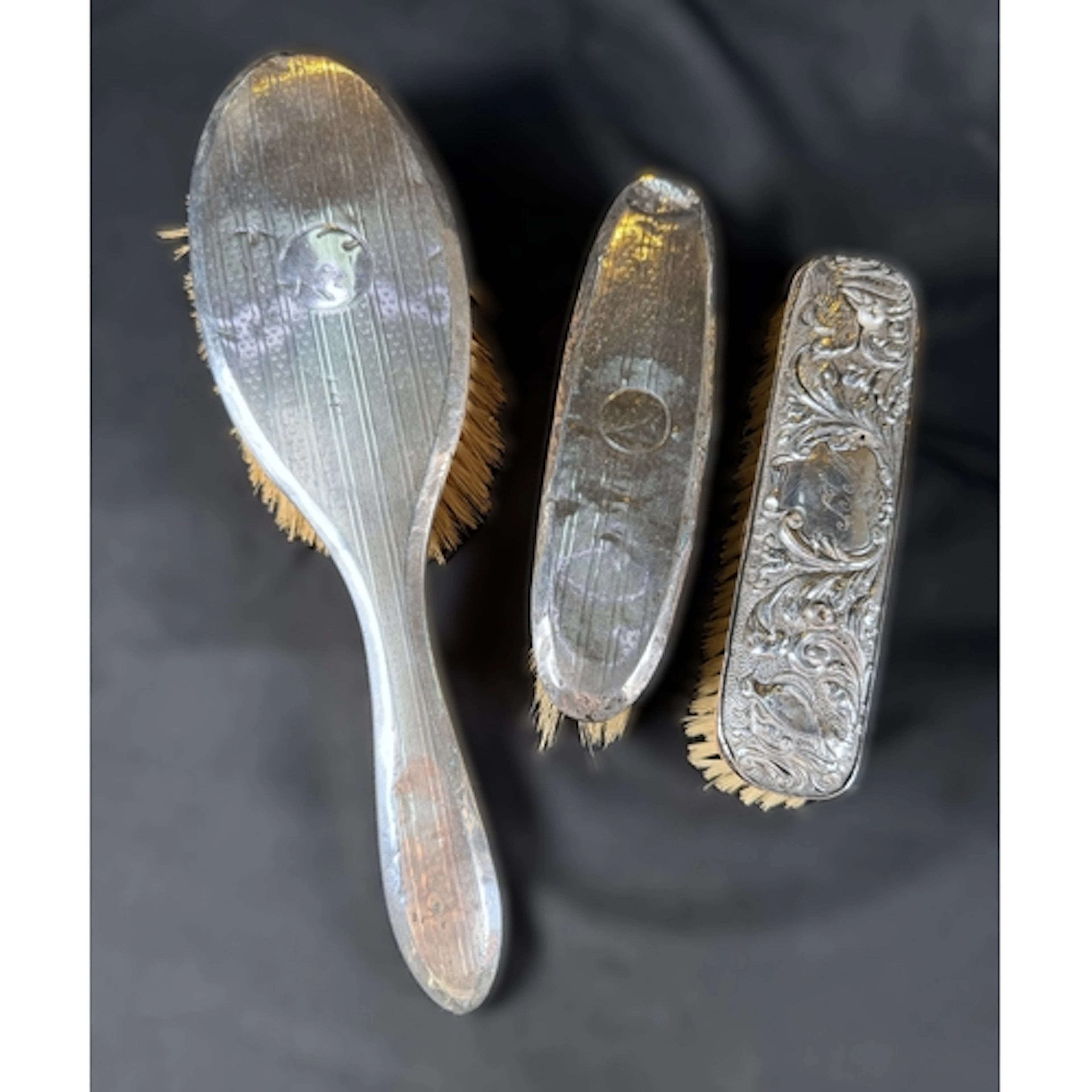 A hall marked silver backed brush, Chester, two other silver...