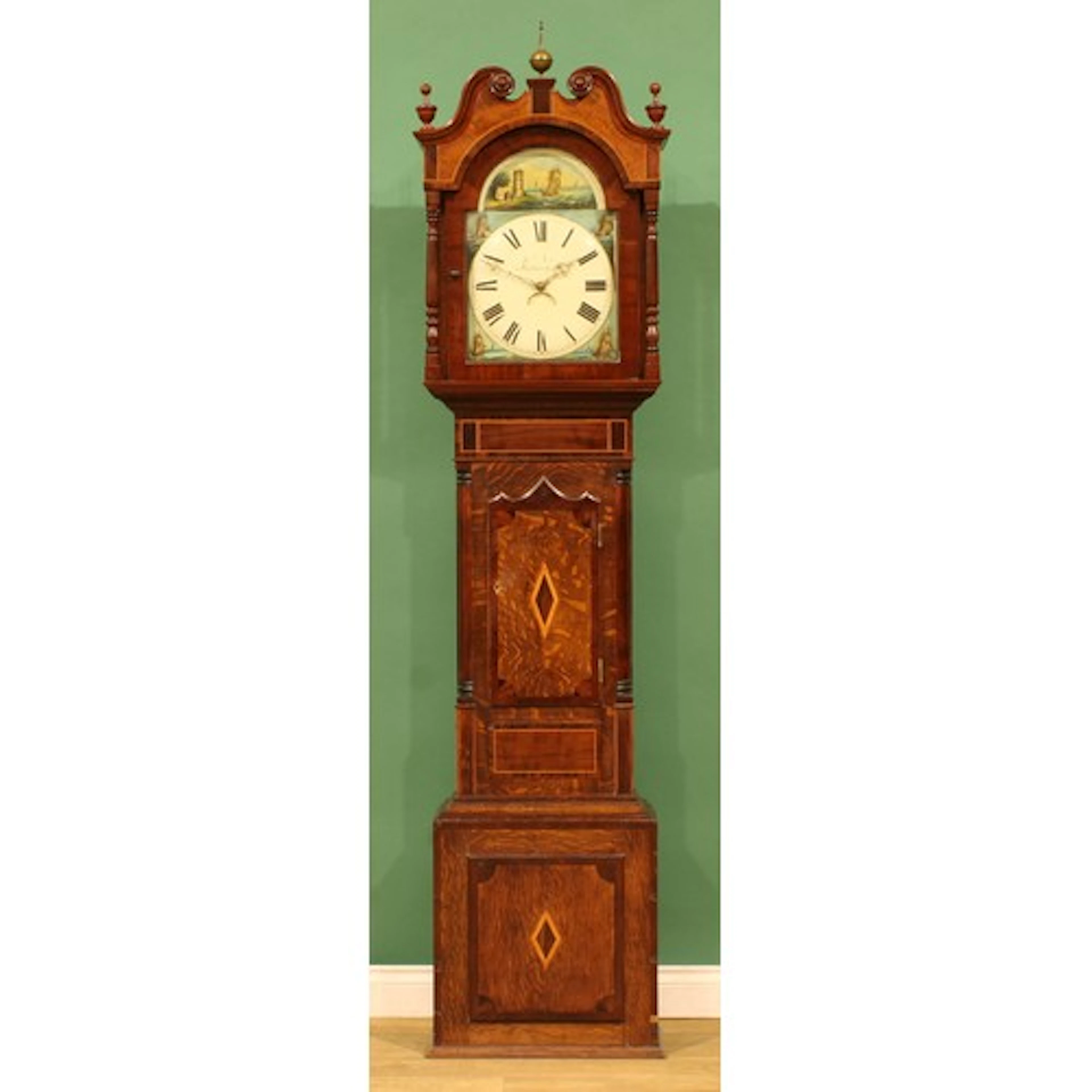 A 19th century oak, mahogany and rosewood longcase clock, 33...