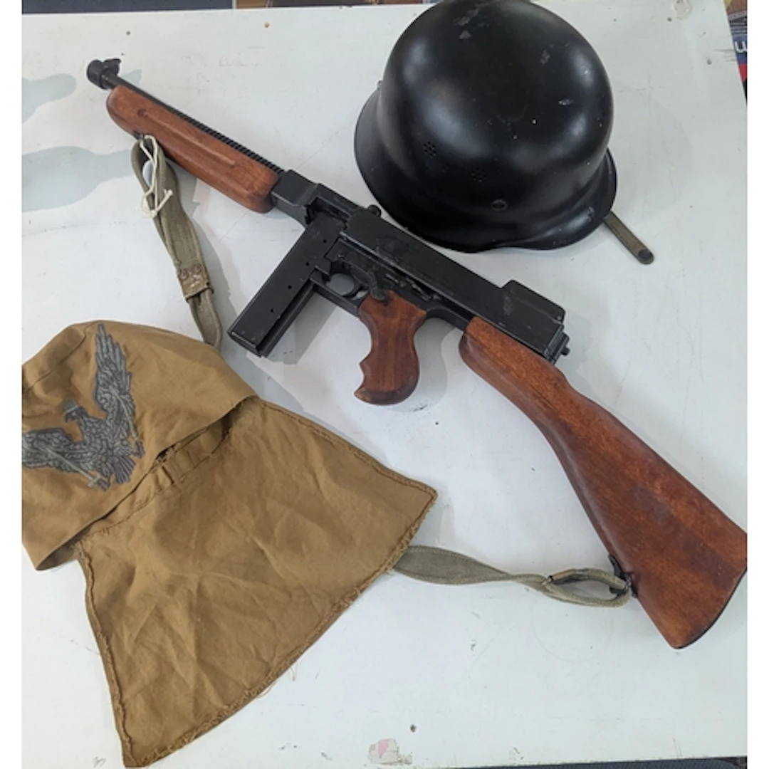 A replica M1928A1.45 ACP sub machine gun, together with a re...
