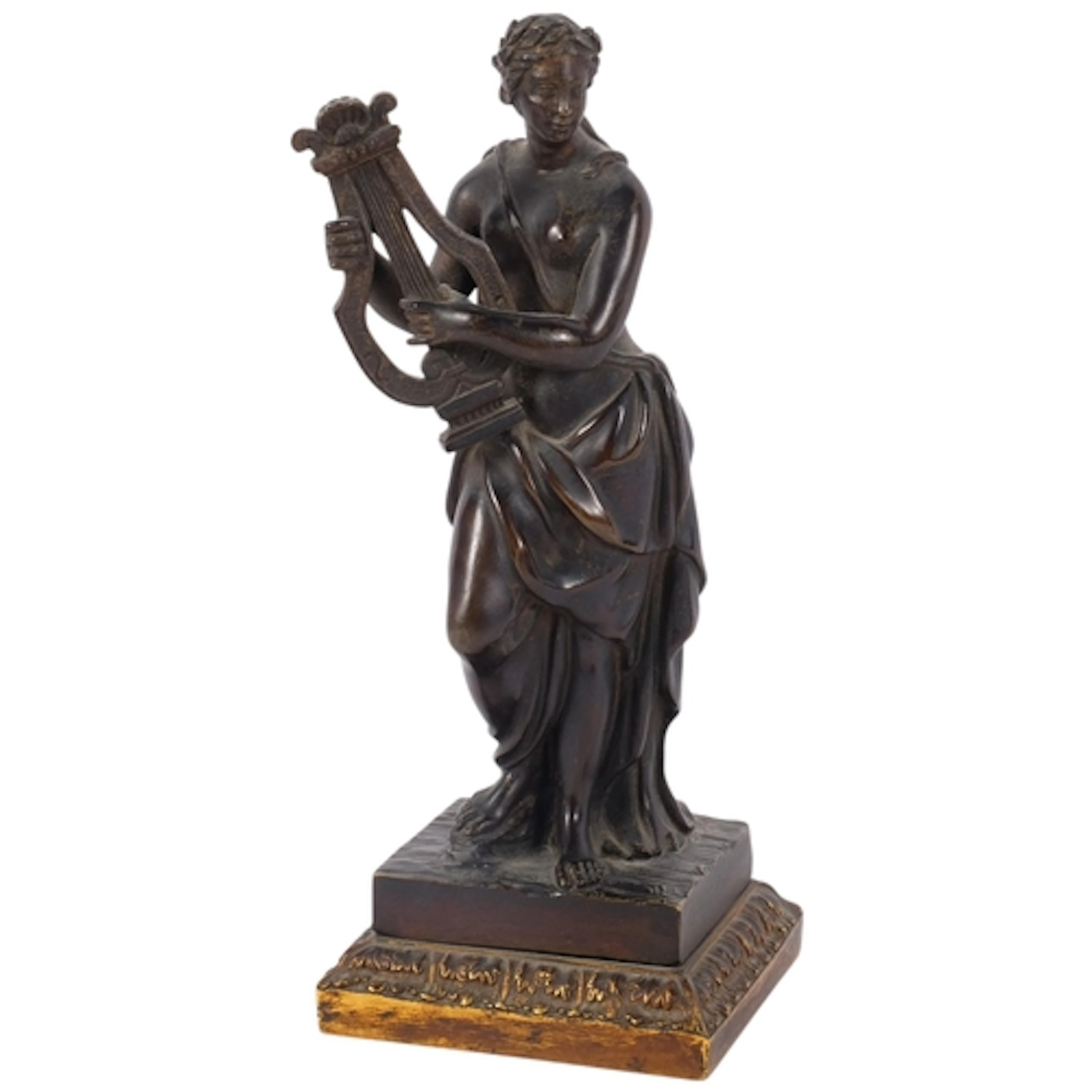 A bronze sculpture of a Classical female musician, on emboss...