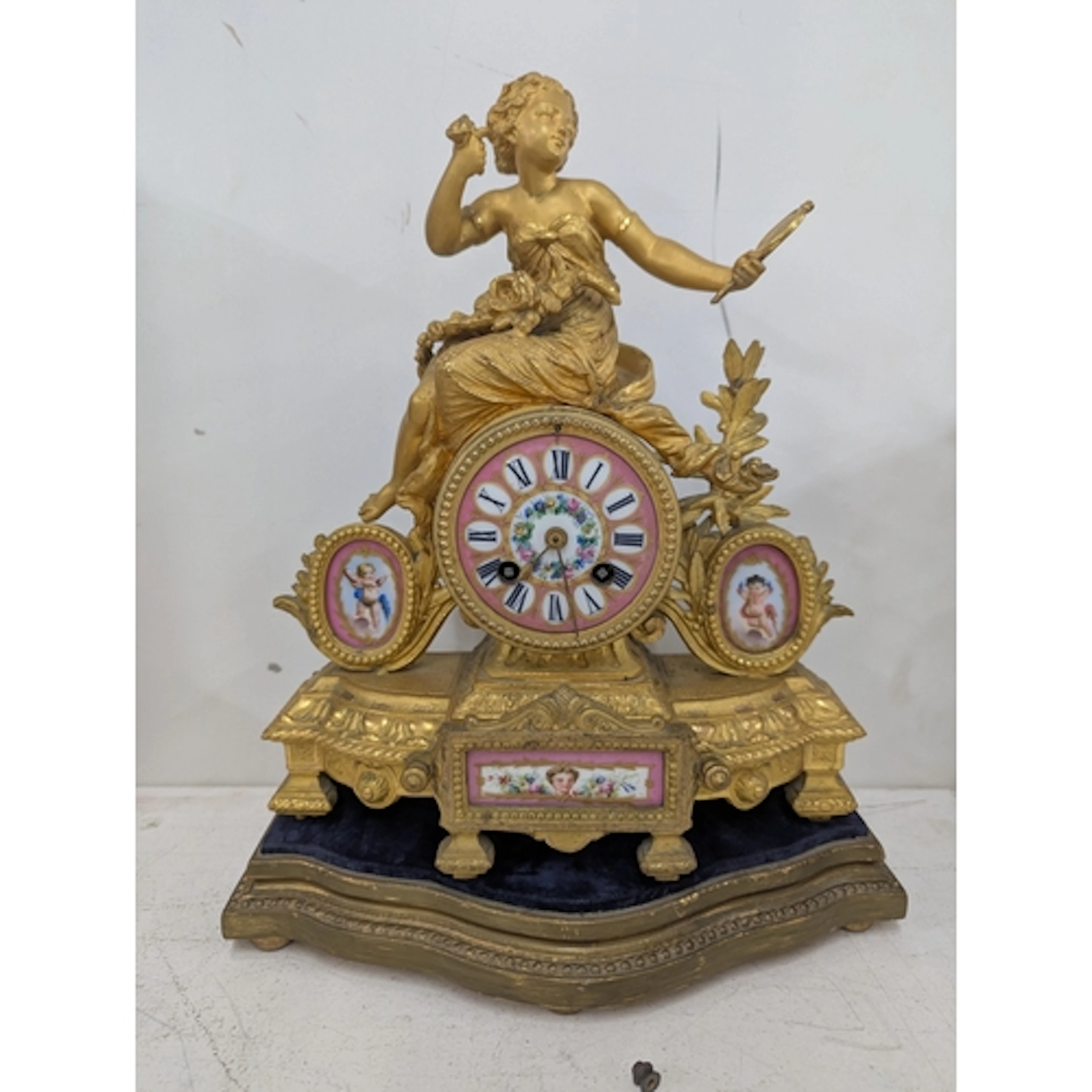 A late 19th century French 8-day mantel clock featuring a ne...