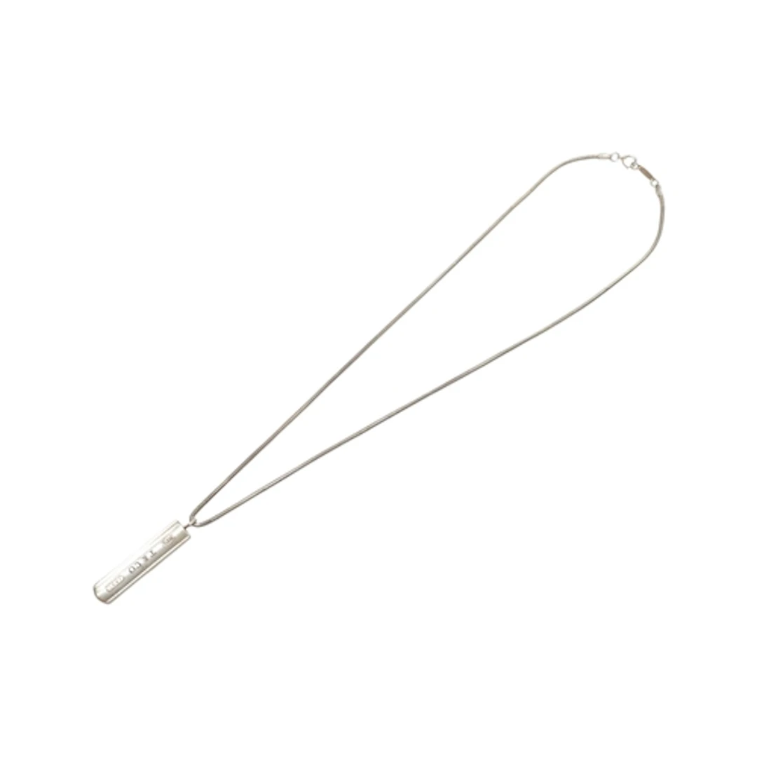 A Tiffany & Co silver ingot pendant, on a Tiffany & Co snake...