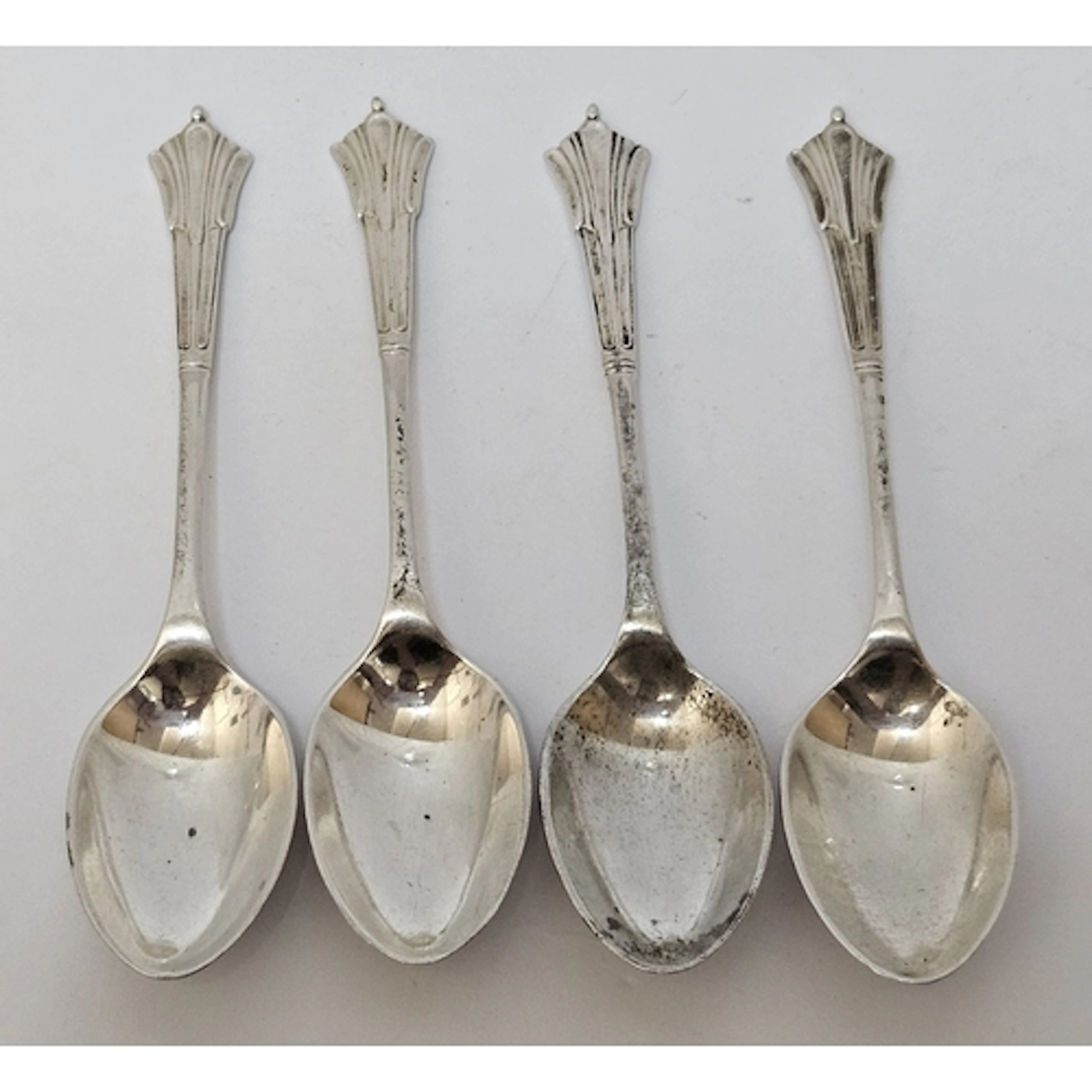 Set of 4 Antique Silver Teaspoons with ornate fluted handles...