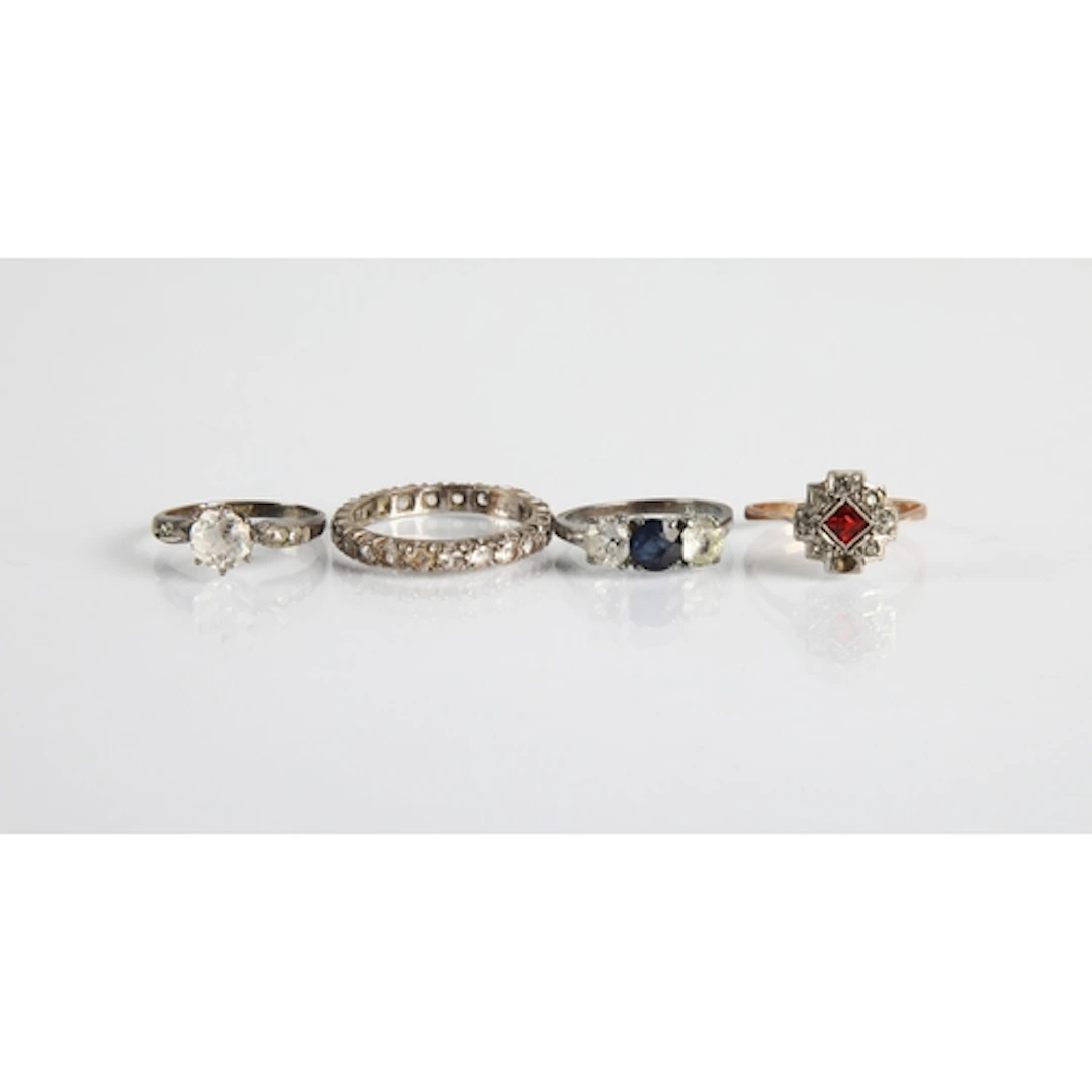 Three assorted ladies dress ring and one Eternity ring