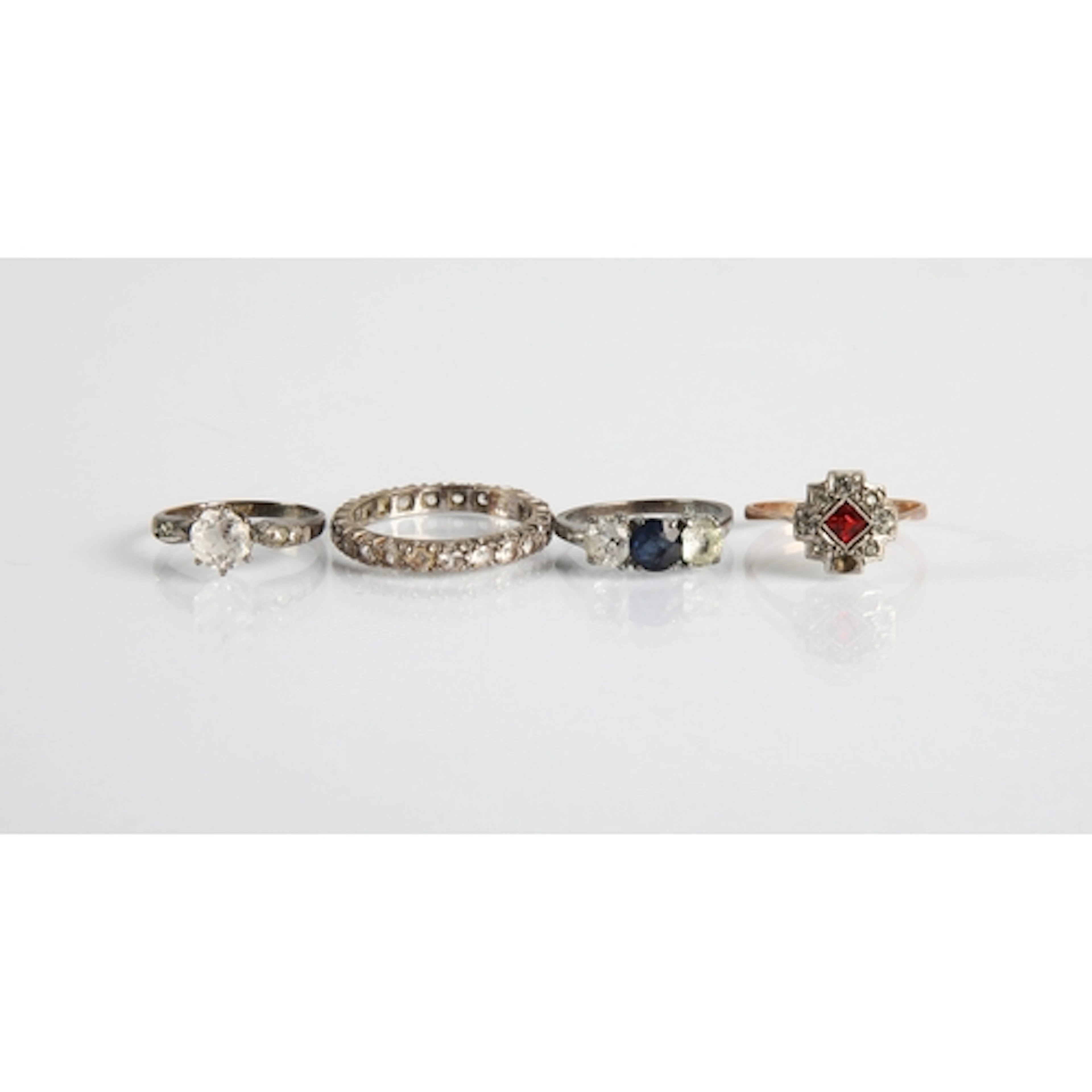 Three assorted ladies dress ring and one Eternity ring