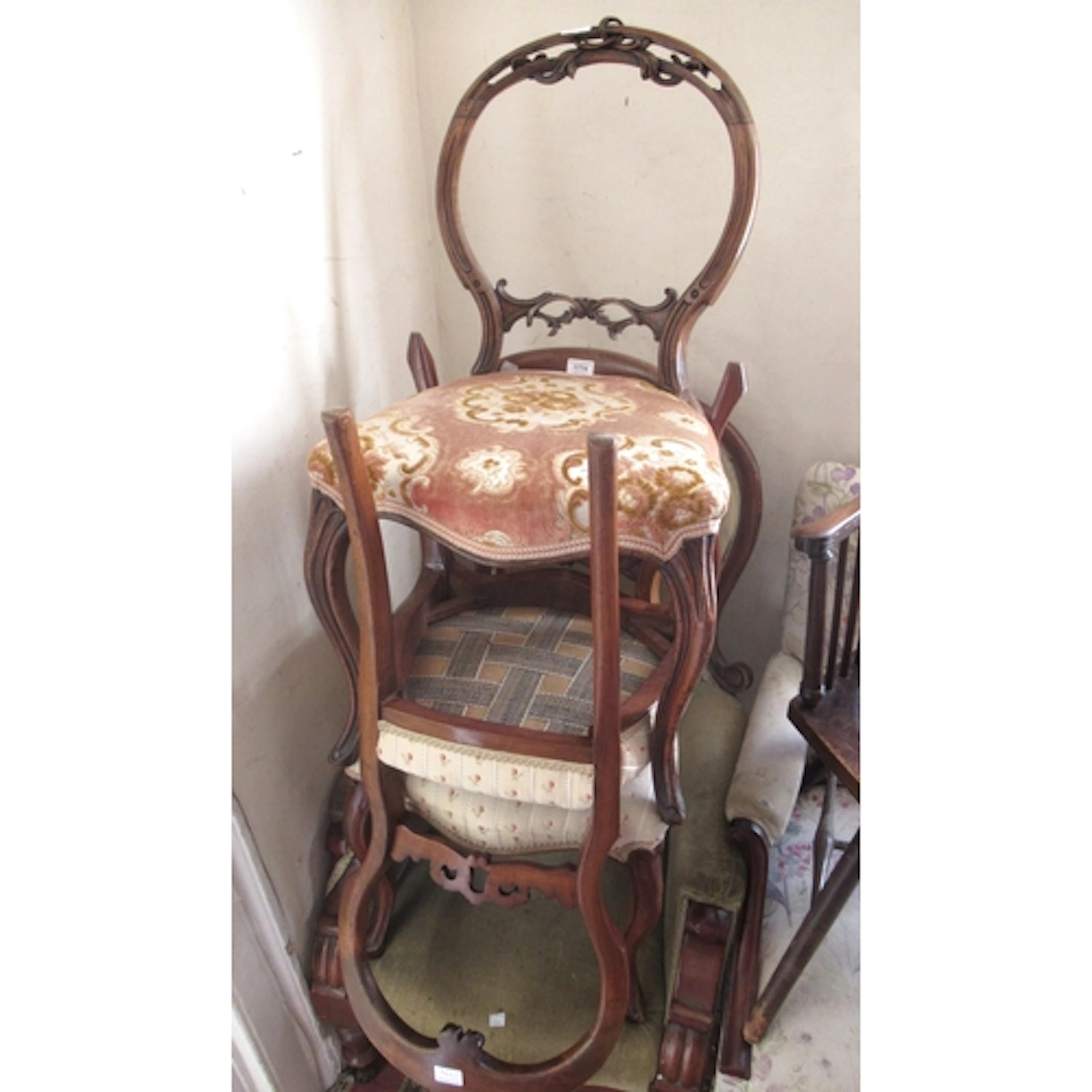 Pair of Victorian walnut balloon back side chairs with carve...