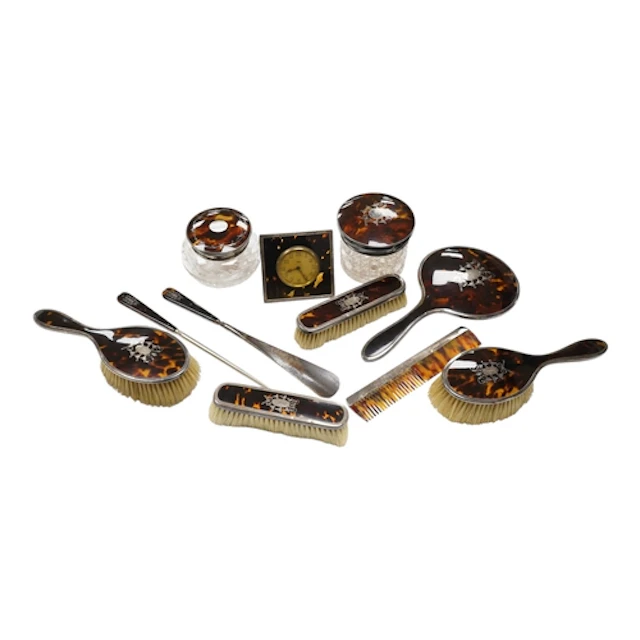 A George V silver and tortoiseshell mounted eight piece toil...
